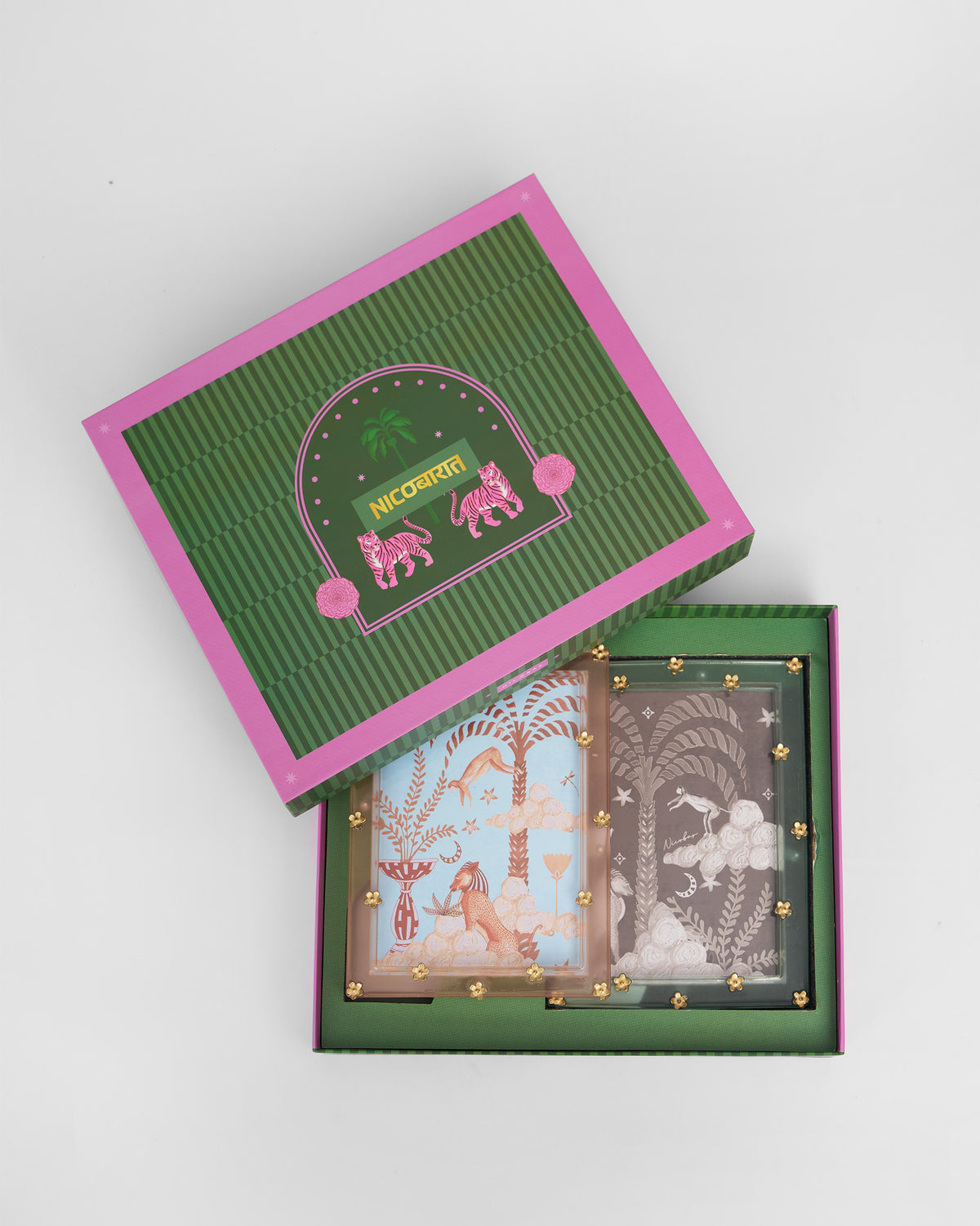 Memoir frames in open gift box showing tropical animal artwork inserts.
