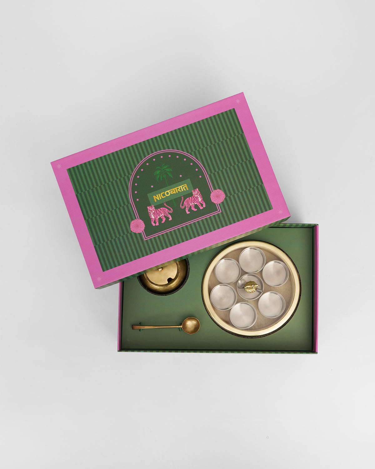 Spice box, brass bowl, and spoon nestled in the Nicobarat gift box.