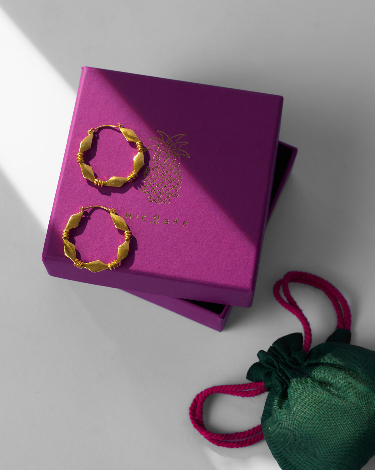 Gold Pillar balis on a purple Nicobar gift box.