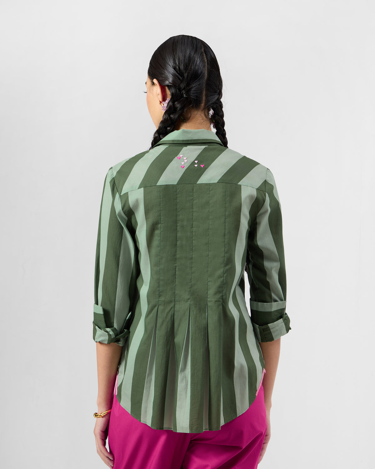 Back of an olive striped Amalis shirt with pink heart embroidery.