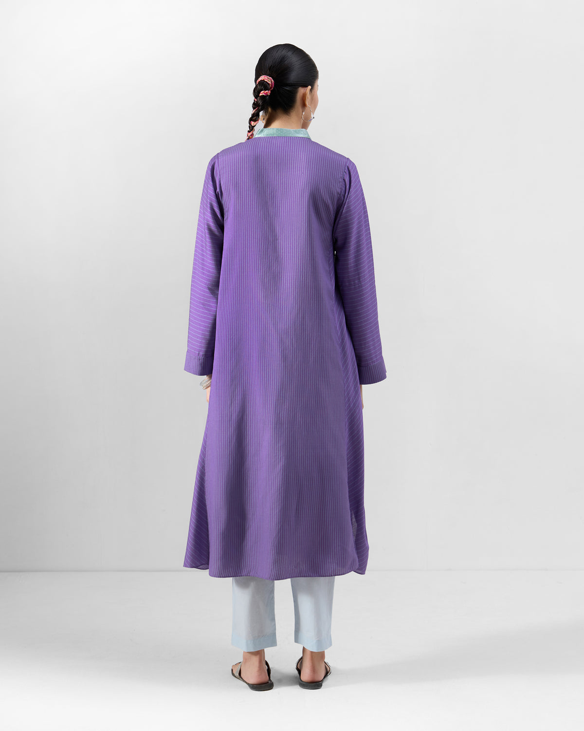 Back of a purple Hatiya Kurta showing the ice blue collar and mid-calf length.