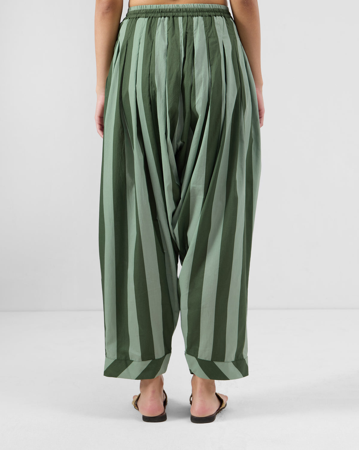 Back of dark green striped Salem pants with cuffed hems.