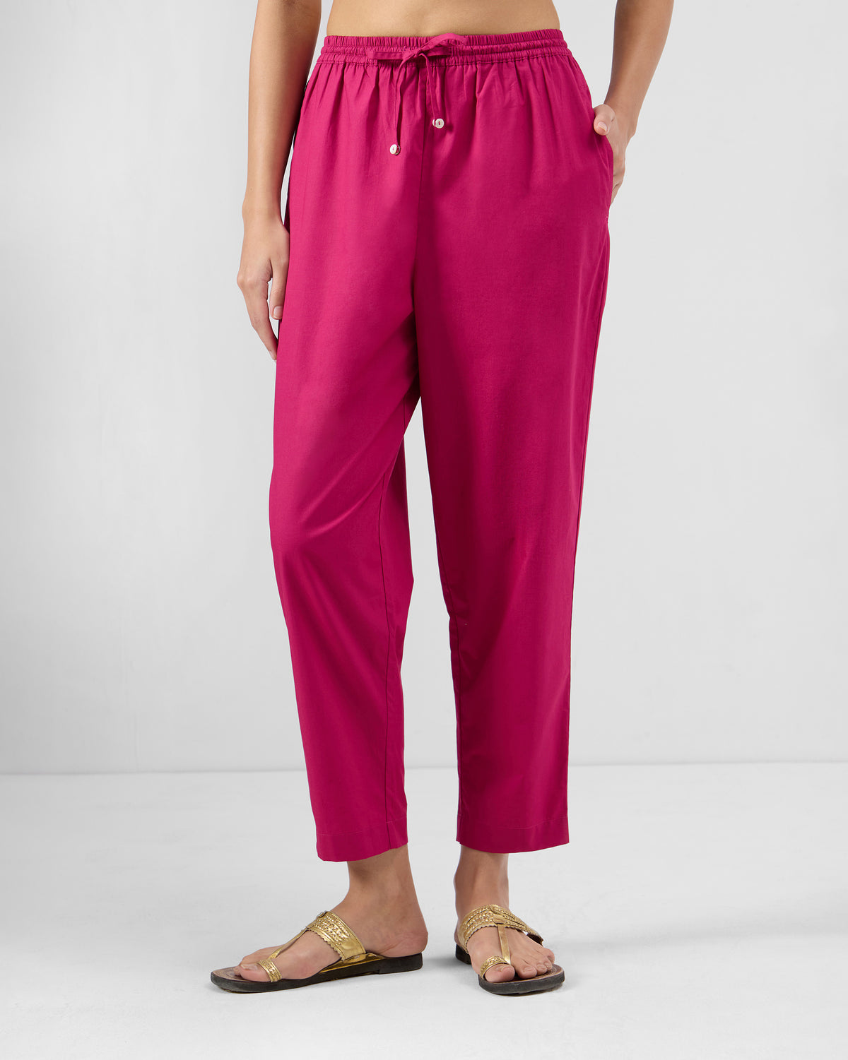 Berry pink Kintara pants with a narrow ankle fit and drawstring waist.