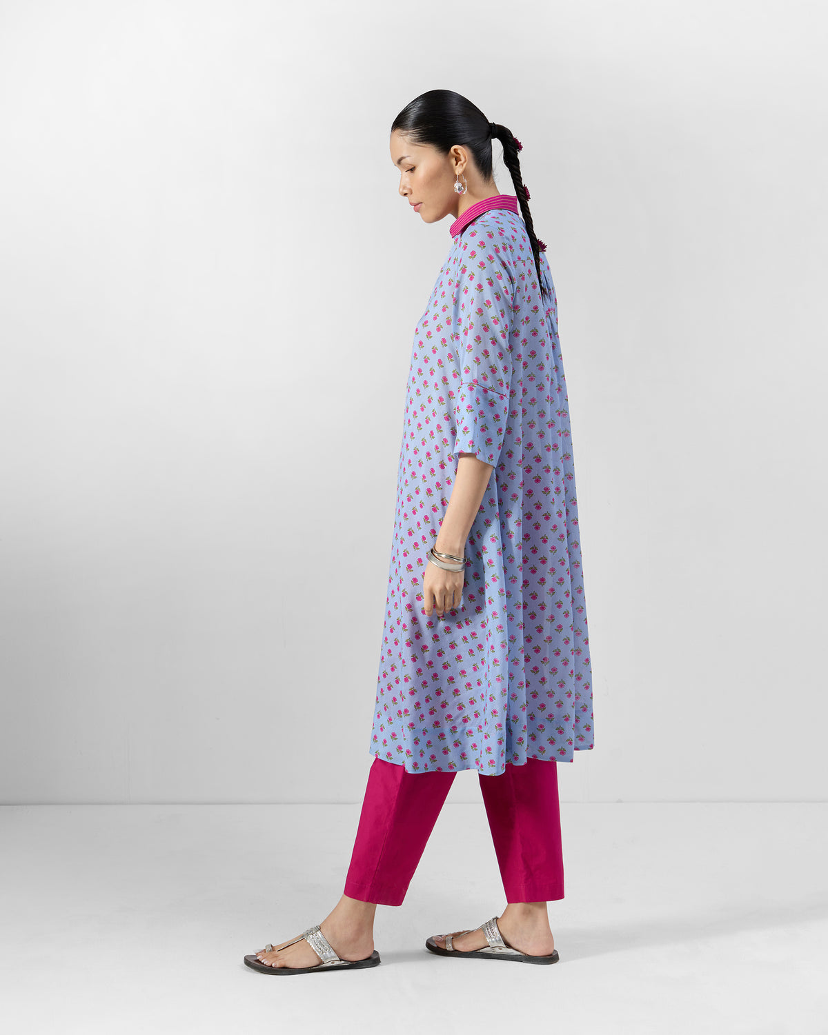 Side view of an ice blue floral Kovvur Kurta with a fuchsia collar.