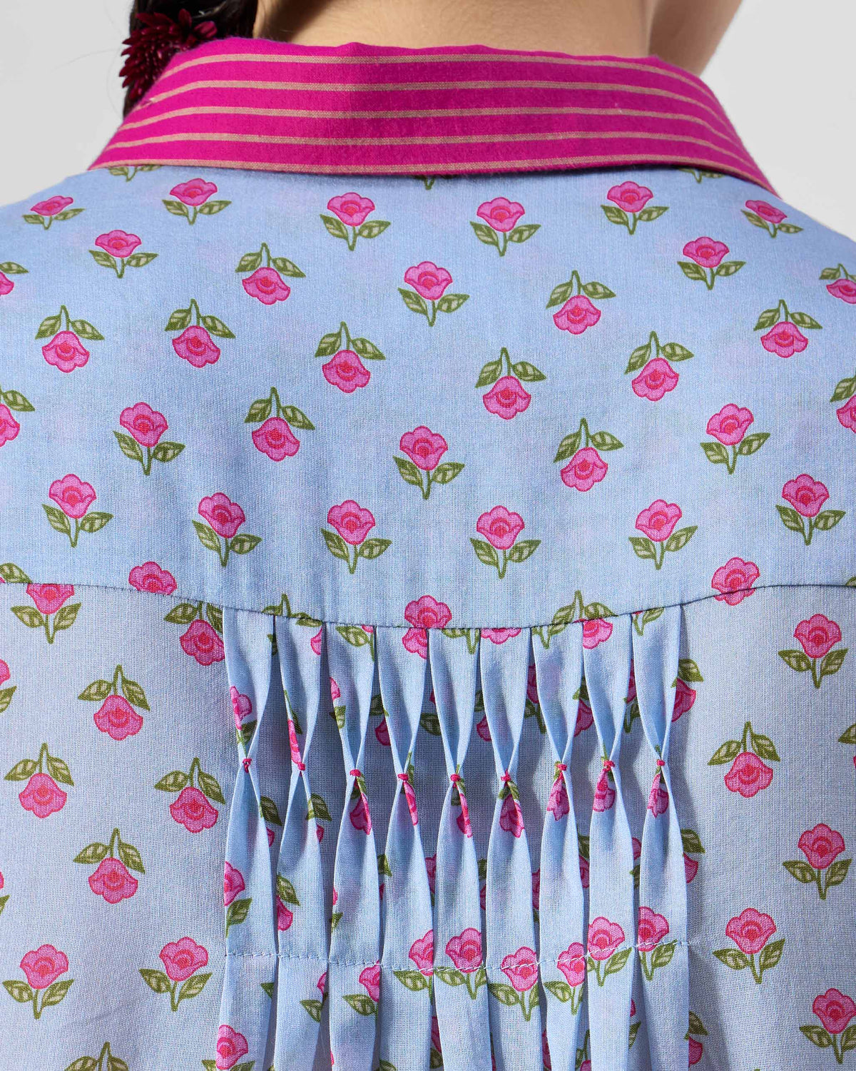 Close-up of smocking below the collar on an ice blue Kovvur Kurta.
