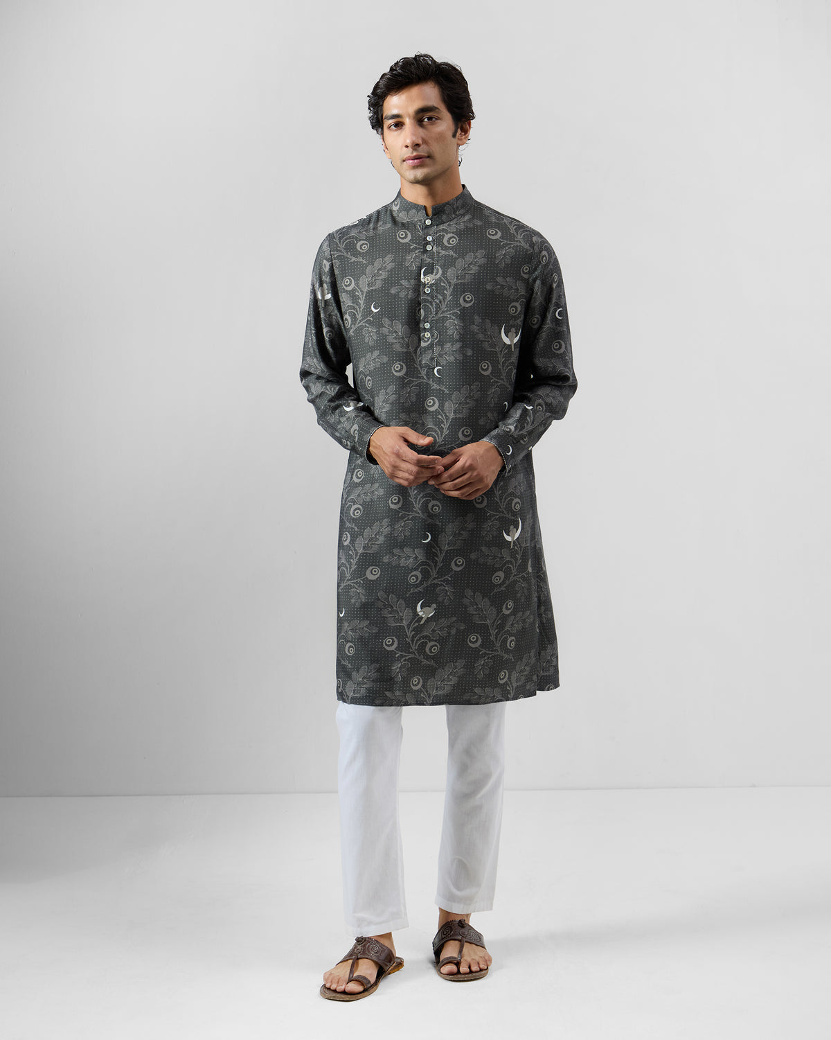 Person wearing a charcoal Rey Kurta with moon and leaf print.