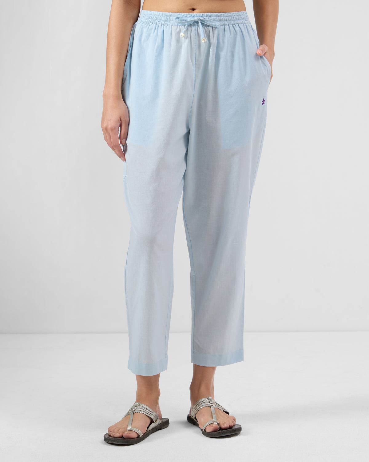 Person wearing ice blue Narrow Pants with a drawstring waist.