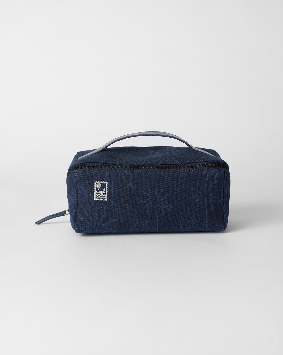 Navy Palm dopp kit with a palm print and hot-air balloon stamp.