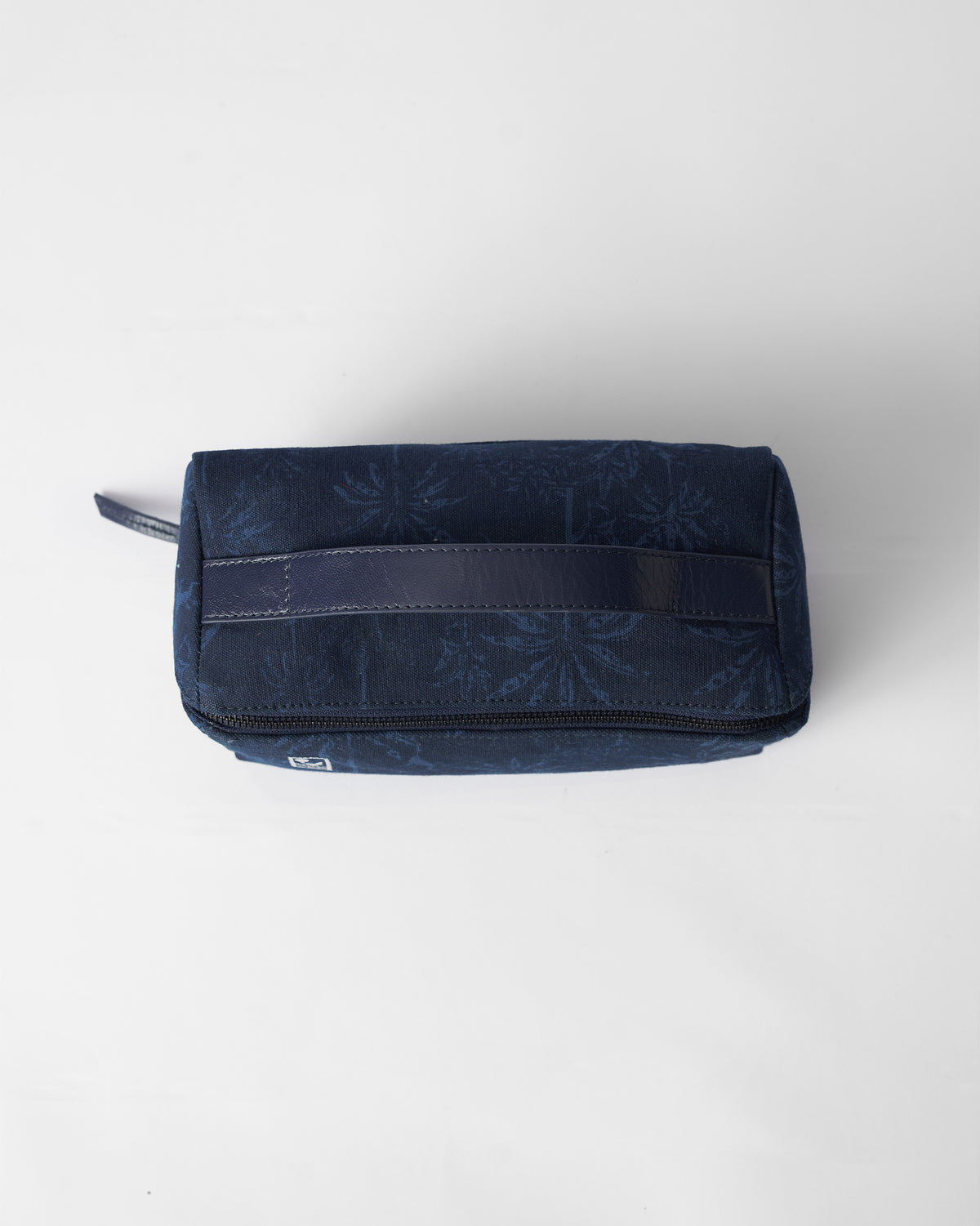 Navy Palm dopp kit with a top handle and palm print.