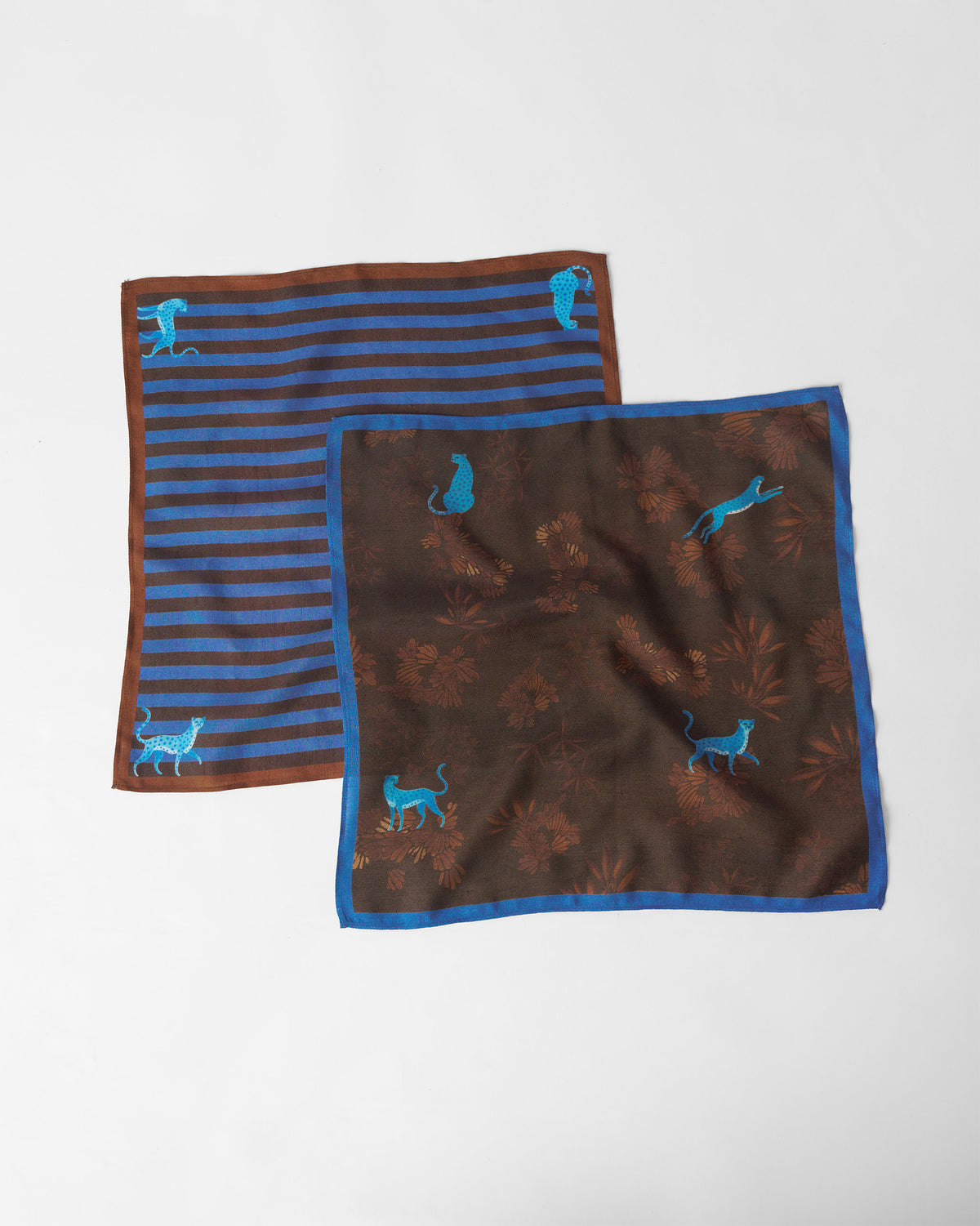 Pair of brown and blue tiger pocket squares, one striped and one botanical.