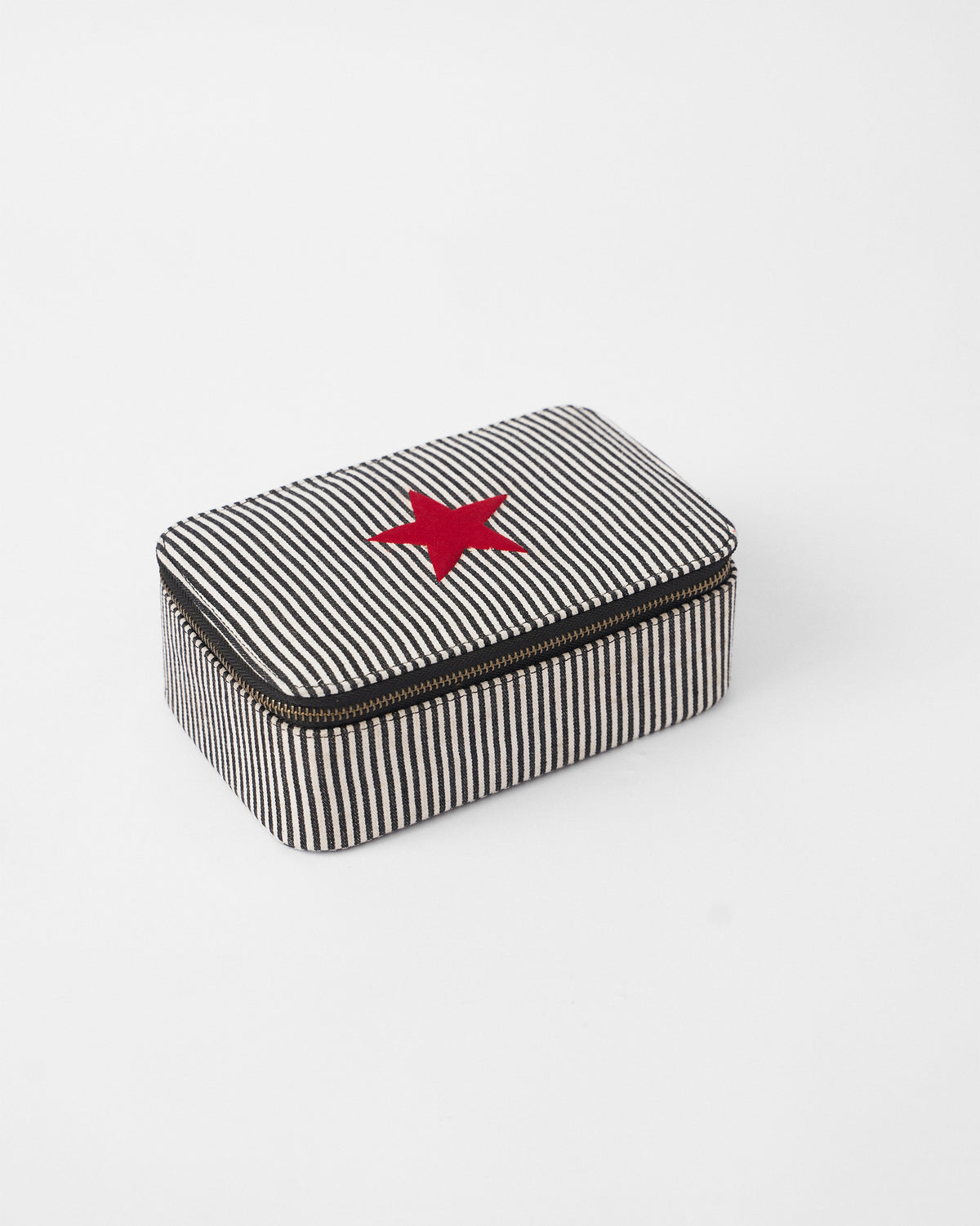 Black and white striped Tara jewellery organiser with a red star on the lid.