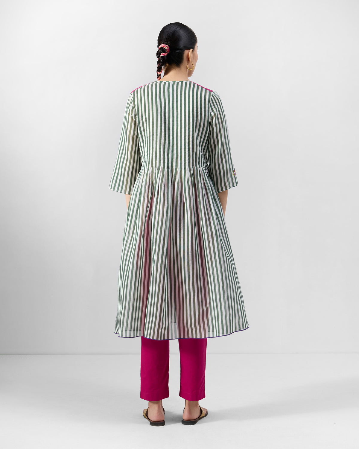 Back of an emerald-and-ivory striped Konark kurta with a gathered A-line skirt.