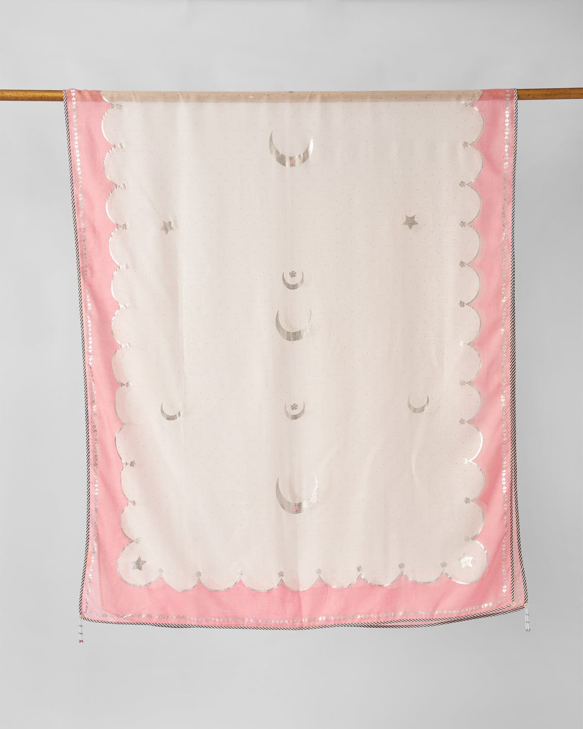 Ivory and pink Keya Dupatta hung showing silver moon and star motifs.