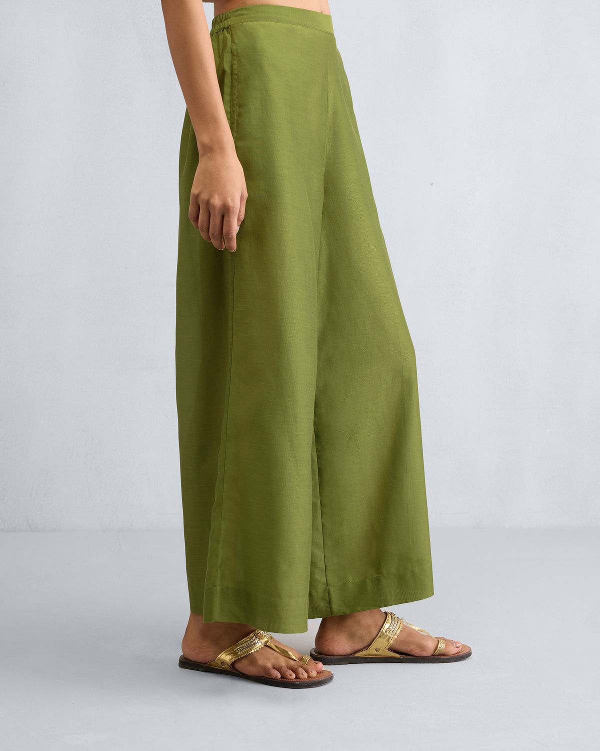 Side view of olive Basic Pyjamas with a straight wide leg.