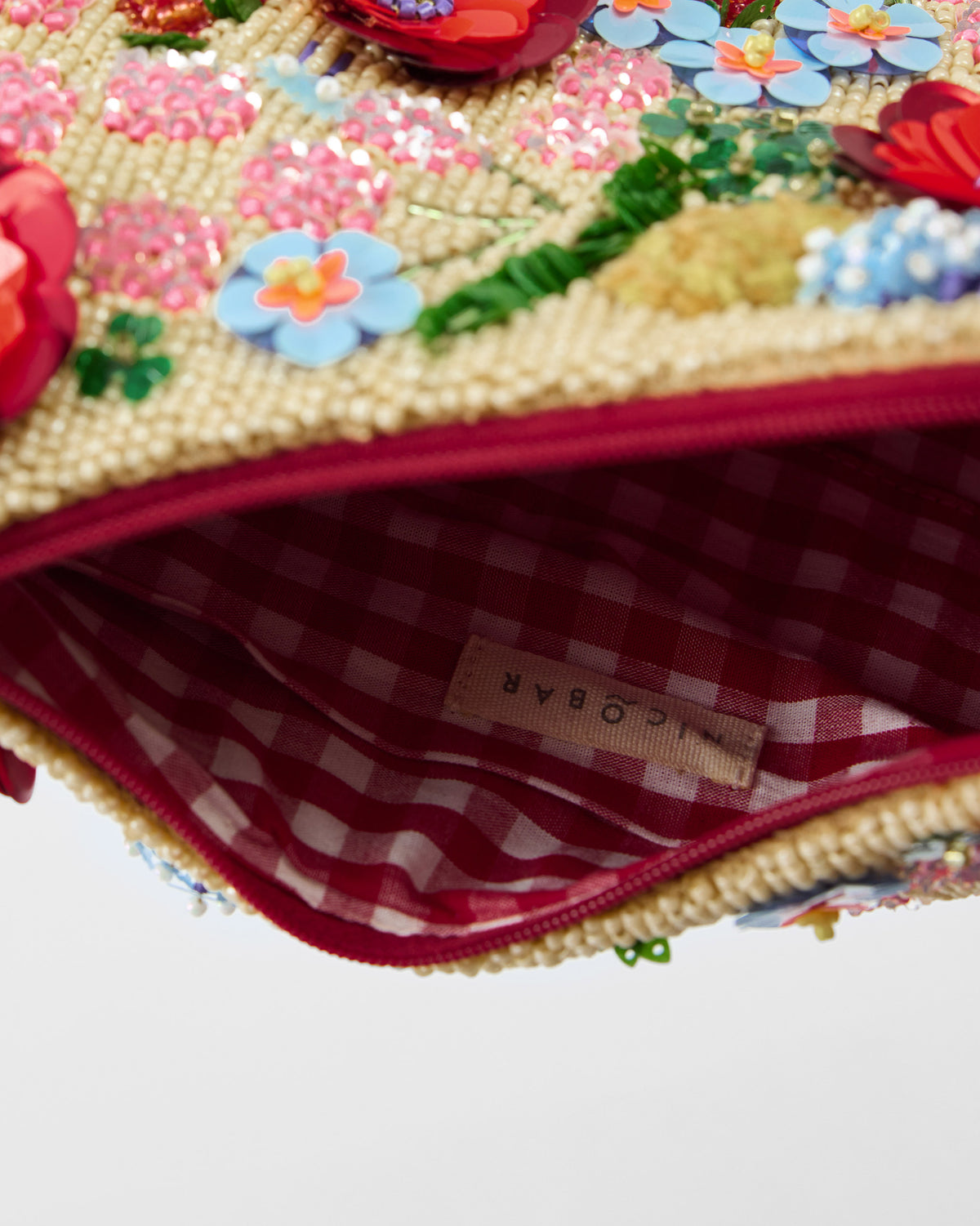 Close-up of the Bloom Bag showing check lining and floral beads.