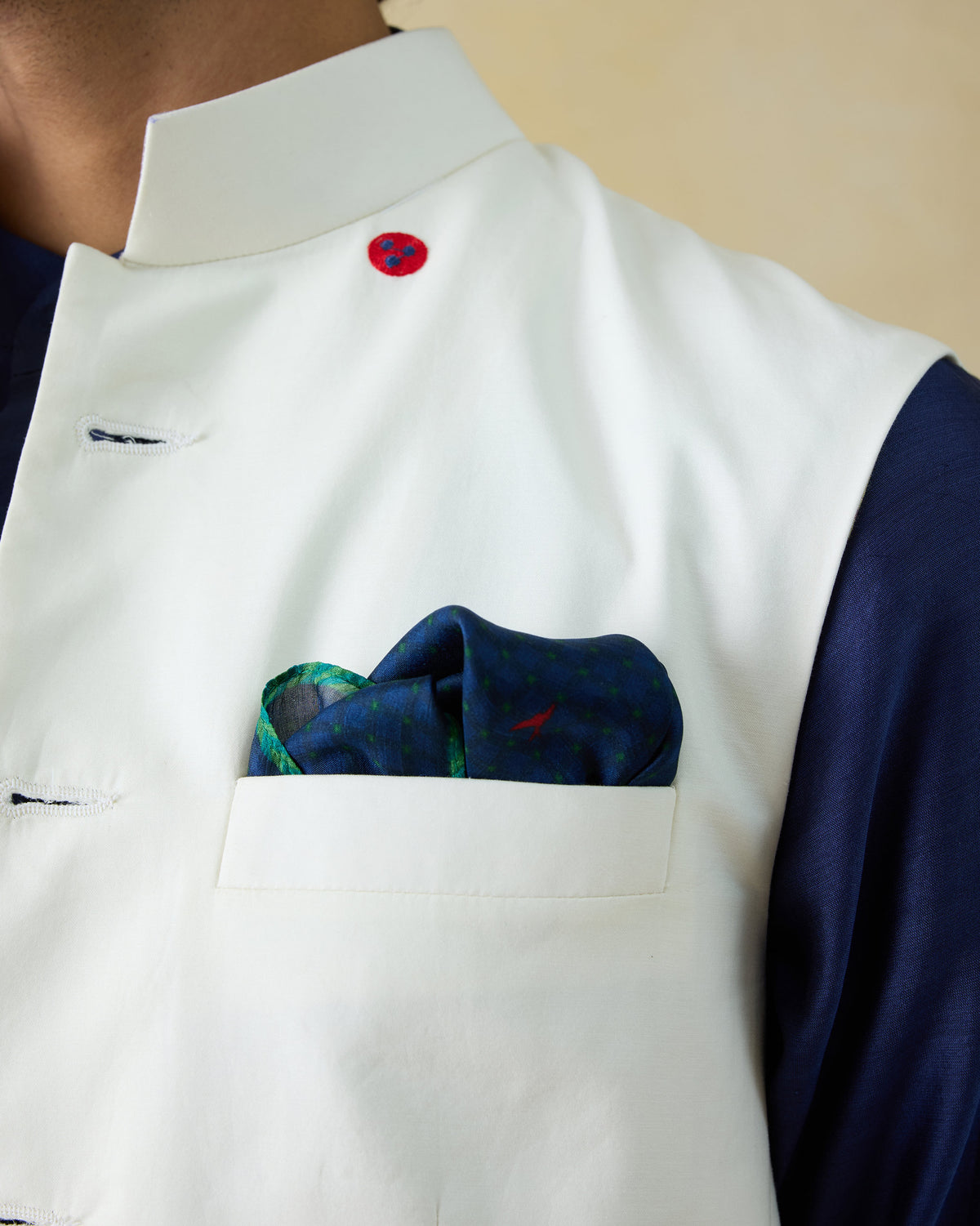 Navy Firefly Pocket Square with a red bird worn in a jacket pocket.