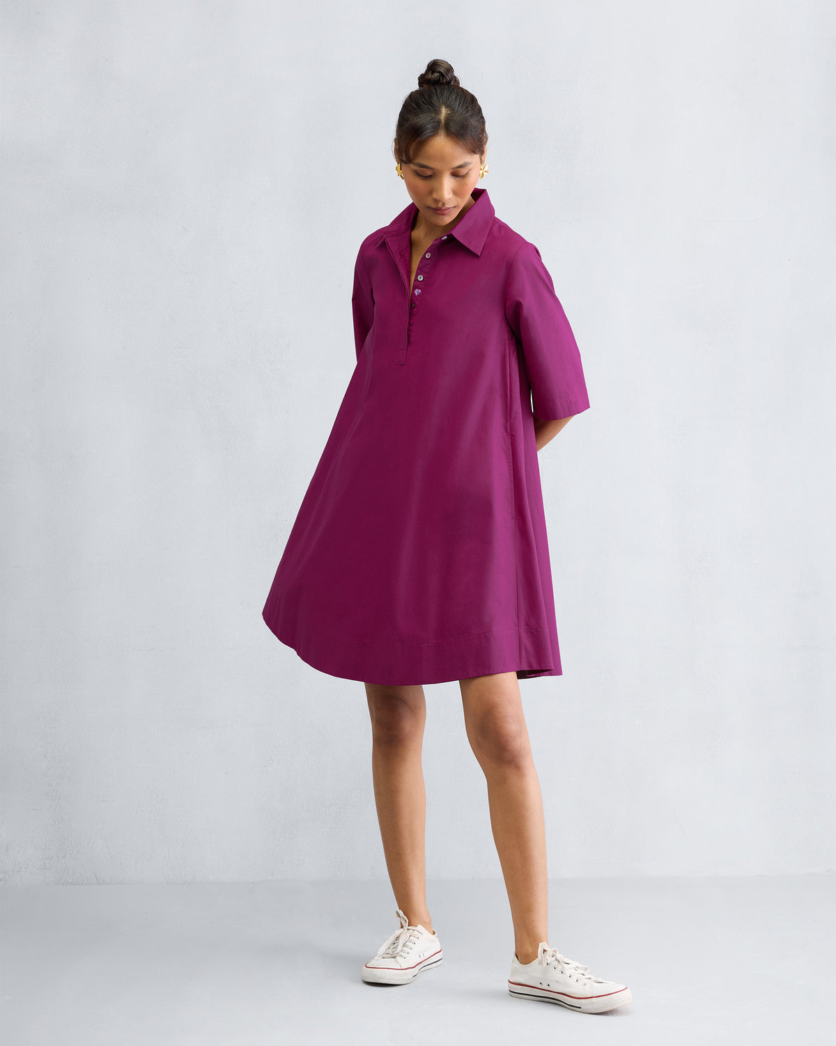 Person wearing a mulberry A-line Short Dress with short sleeves.