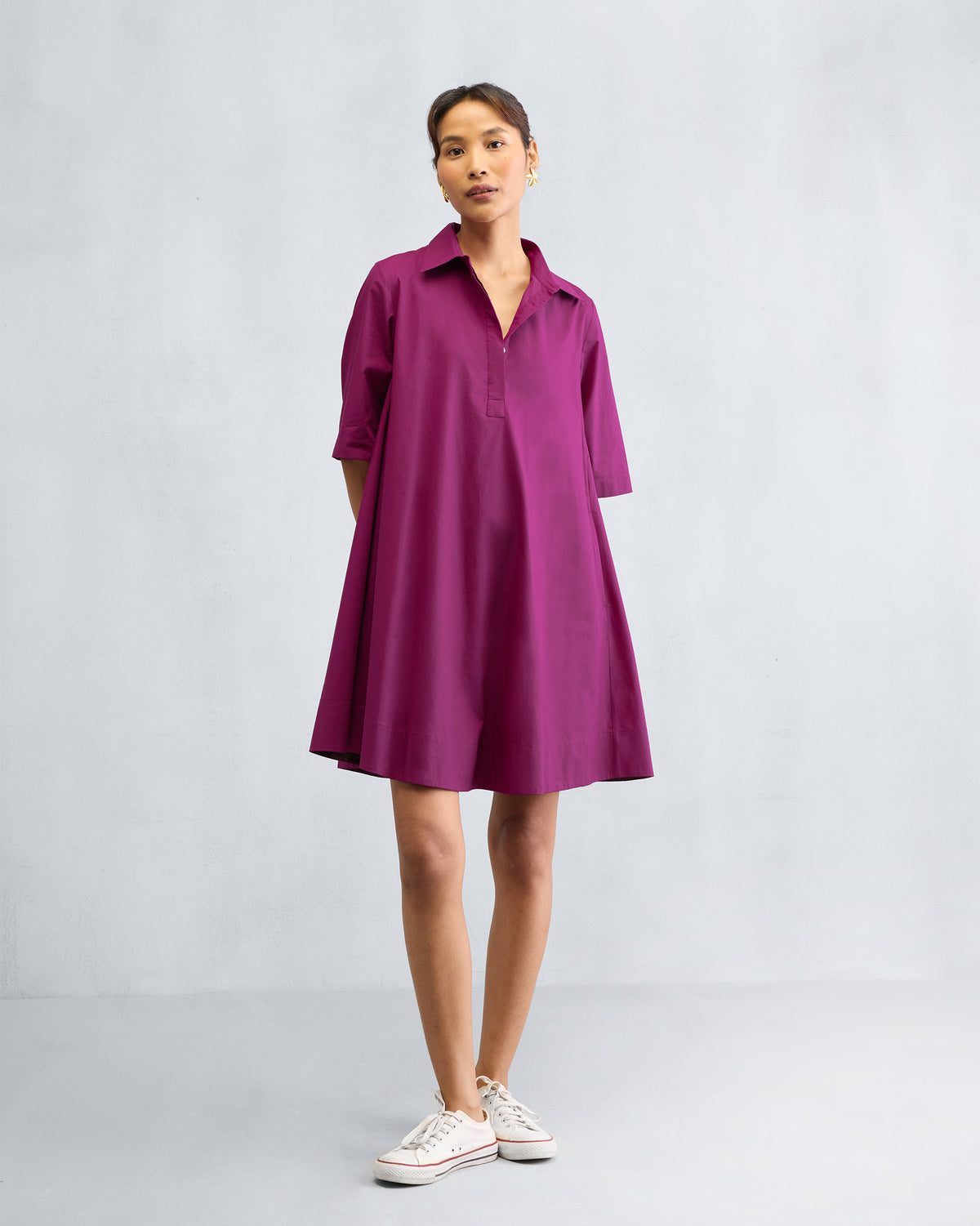 Person wearing a mulberry A-line Short Dress with a flared skirt.