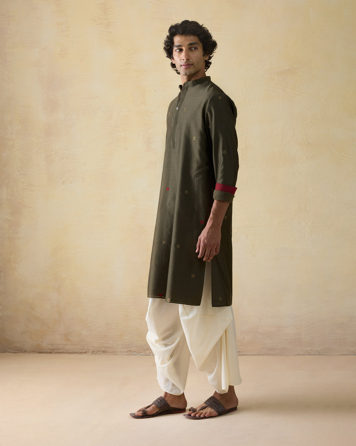 Olive green Neckband Kurta with circular embroidery worn at a three-quarter angle.