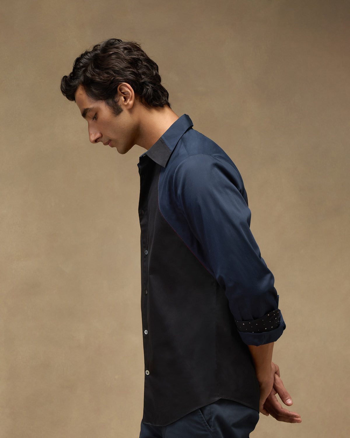 Side view of a black-and-navy Moonrise shirt with colour-blocked sleeves.