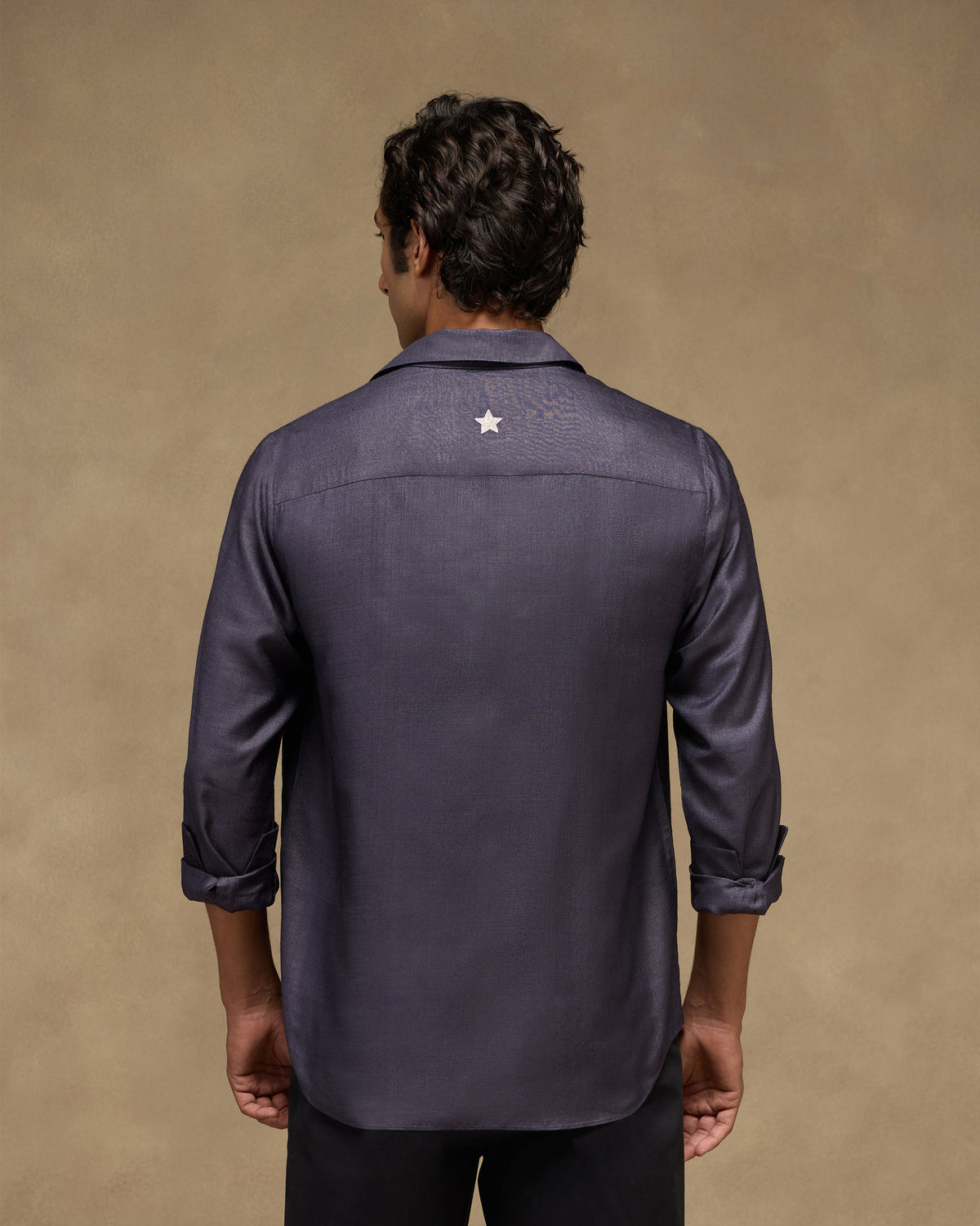 Back of a light purple Afterglow shirt with a silver star on the yoke.