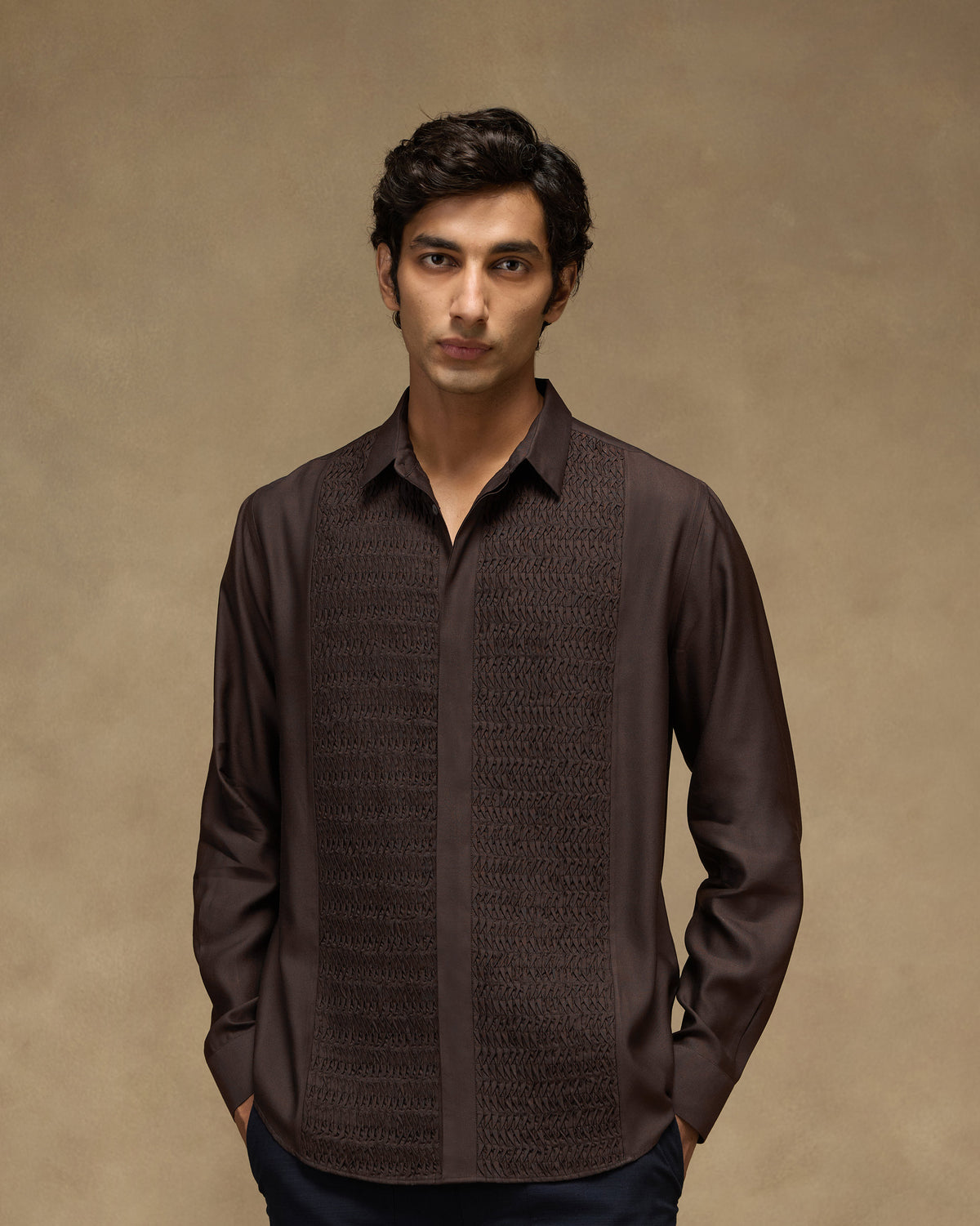 Person wearing a deep brown Afterhours shirt with tonal pintuck front panels.