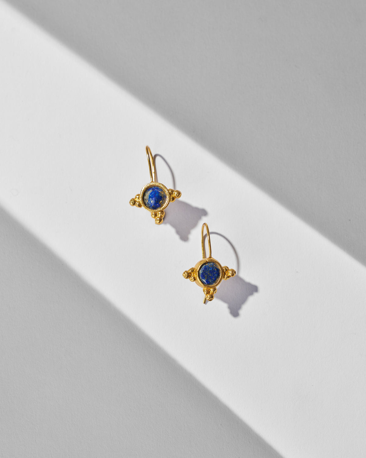 Pair of gold Lapis Drops with round blue stones.