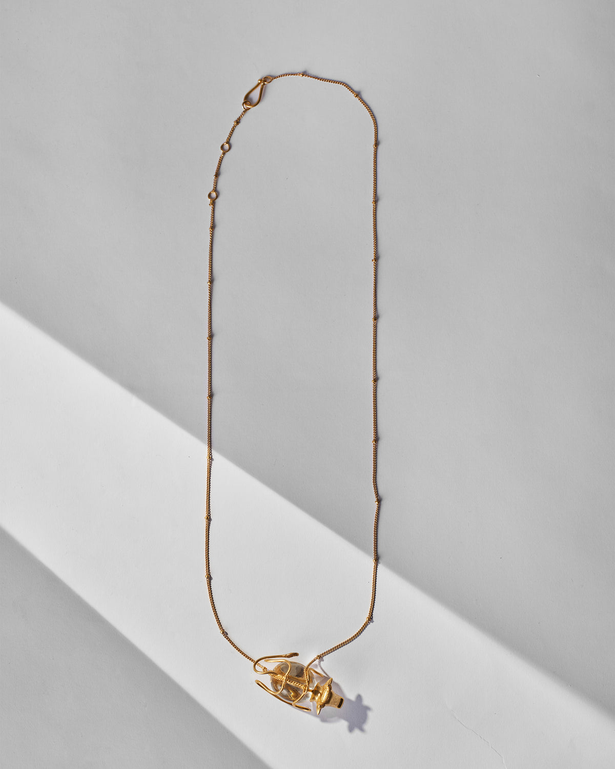 Full gold Nandi necklace with a beaded chain and bull pendant.