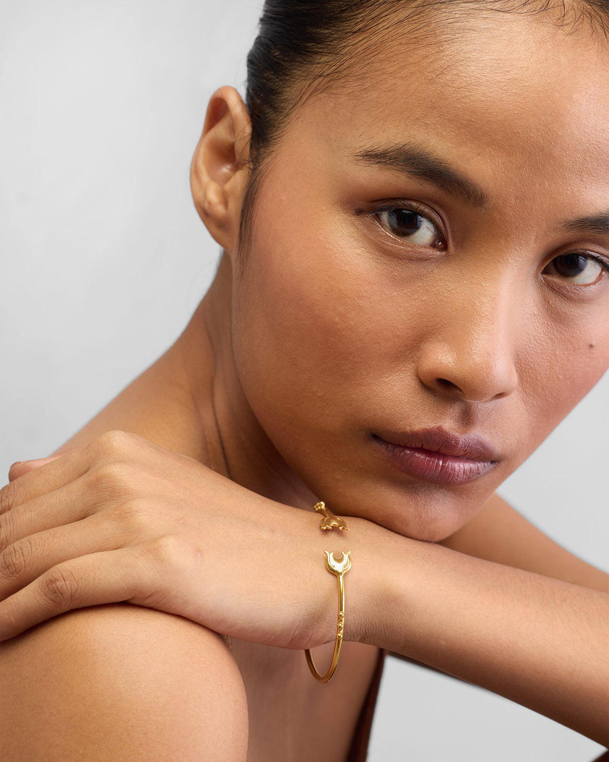 Person wearing Chaandphool Cuff on the wrist, with a crescent end visible.