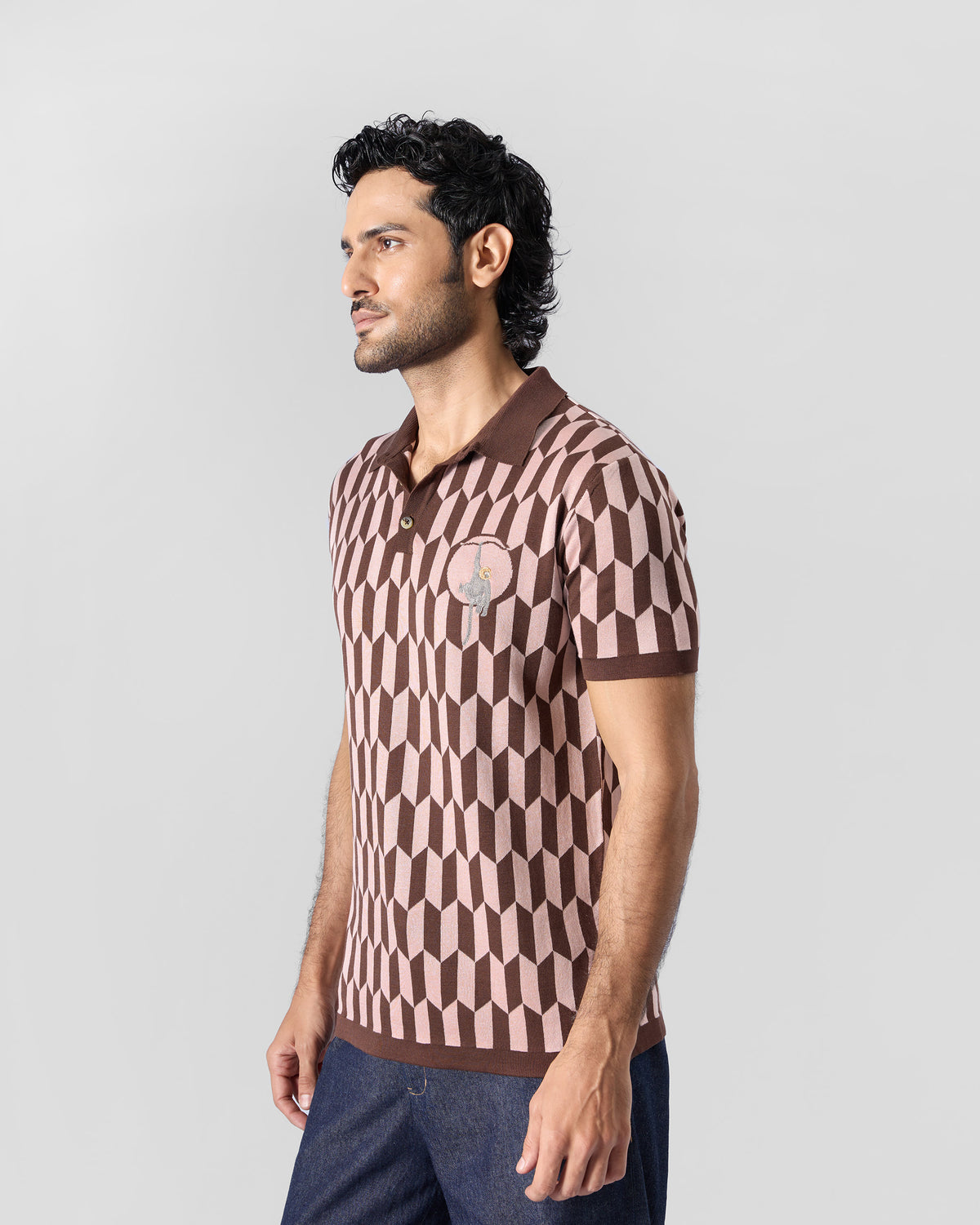 Side view of a brown-and-pink Langur polo with geometric knit.