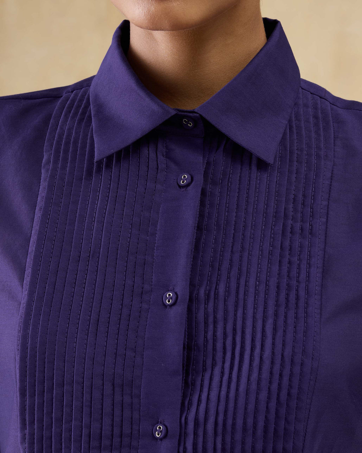 Close-up of the pintuck bib and buttons on a purple Tuxedo Shirt.