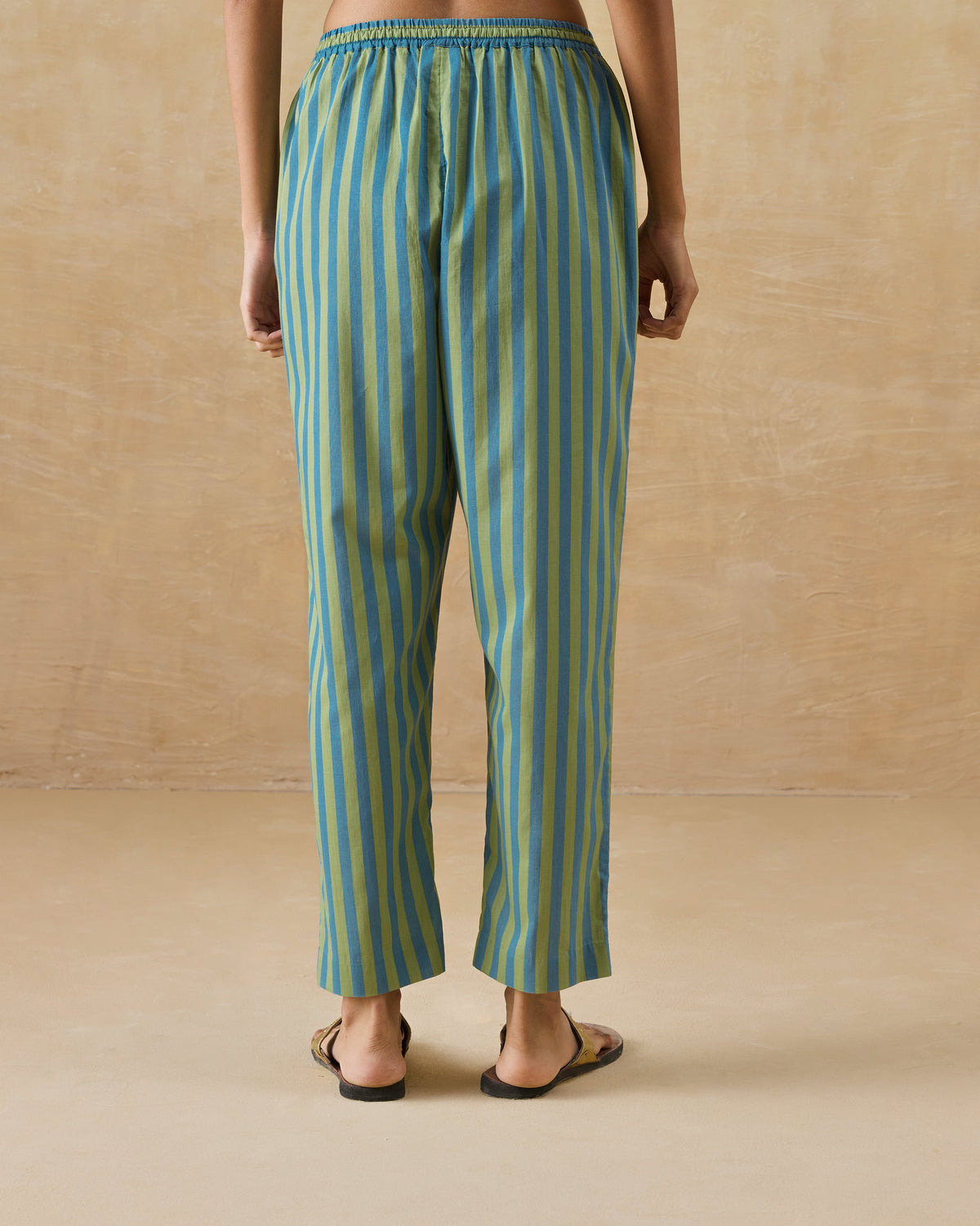 Back of aqua and green striped Arzoie pants with a gathered elastic waist.