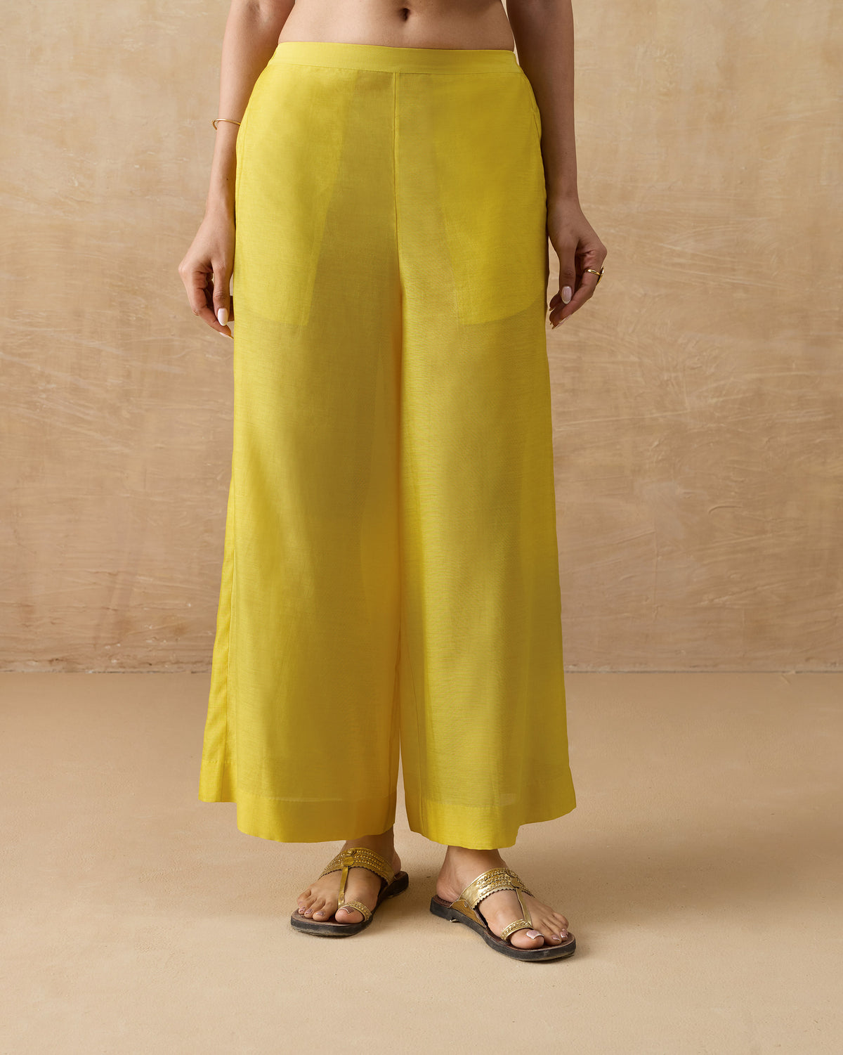 Person wearing chartreuse Basic pyjamas with front patch pockets.