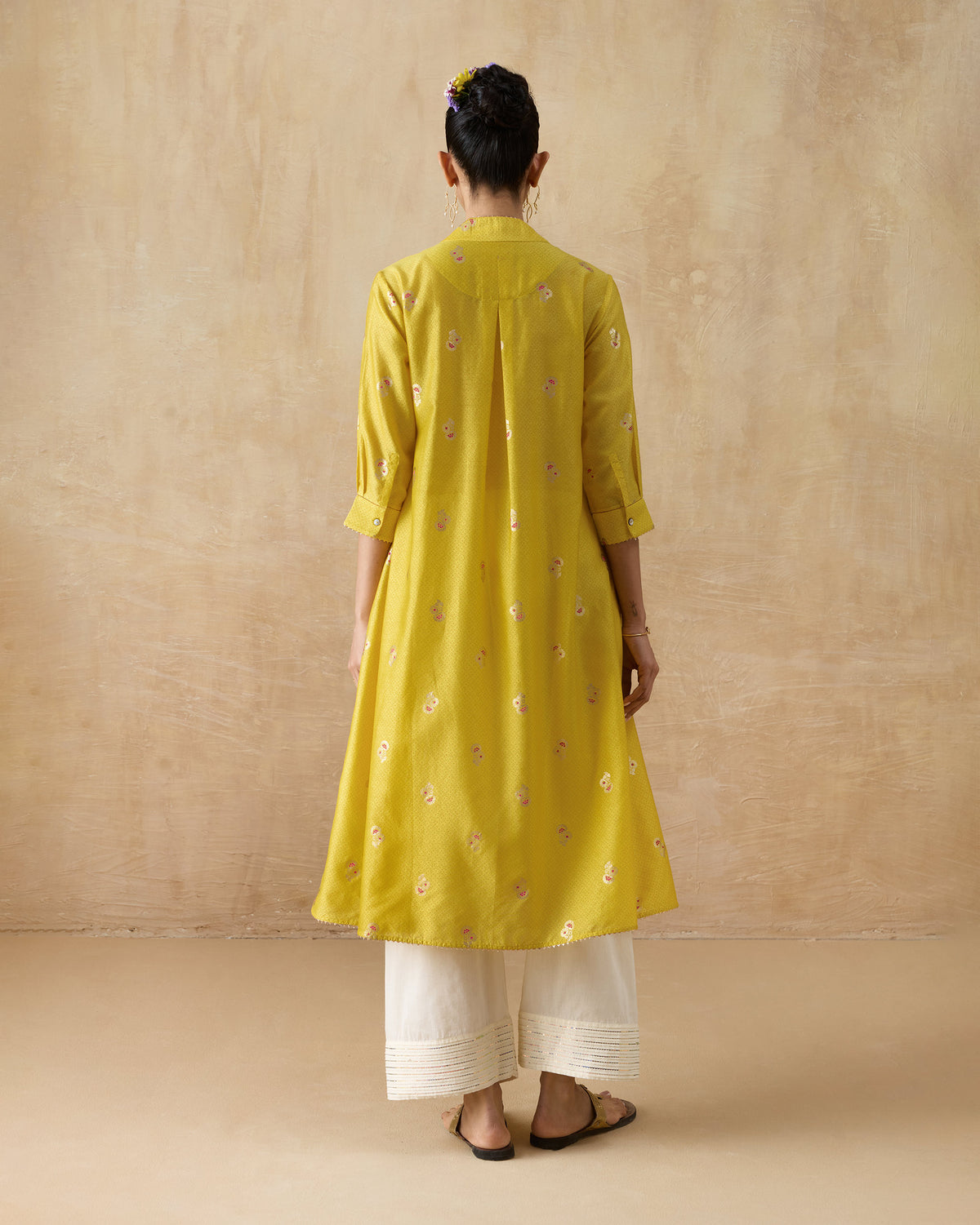 Back of a chartreuse Viva kurta with a central box pleat.