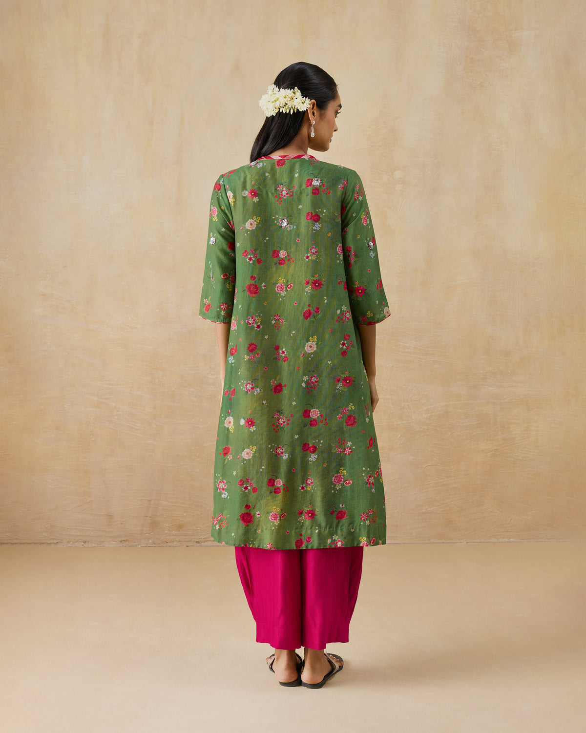Back of an olive green Cascade Kurta with a red floral print.