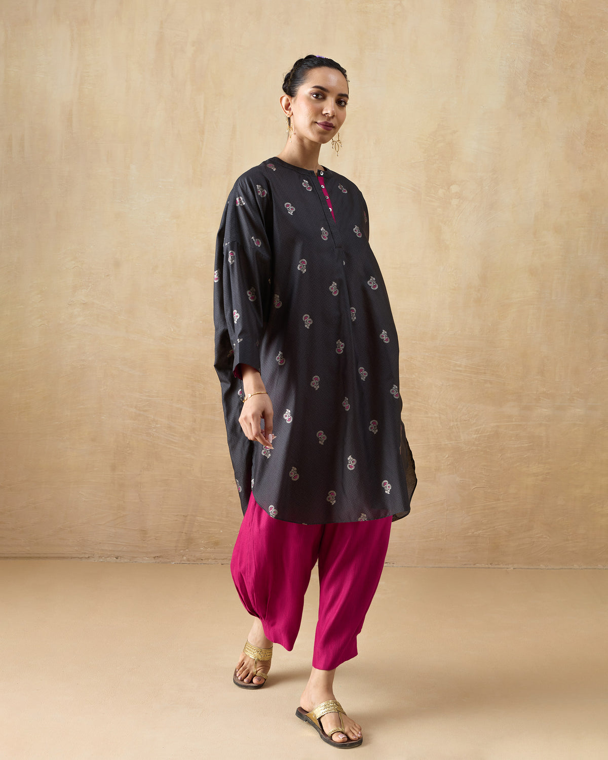 Charcoal Lazy Sunday tunic with scattered pink floral motifs and a relaxed longline fit.