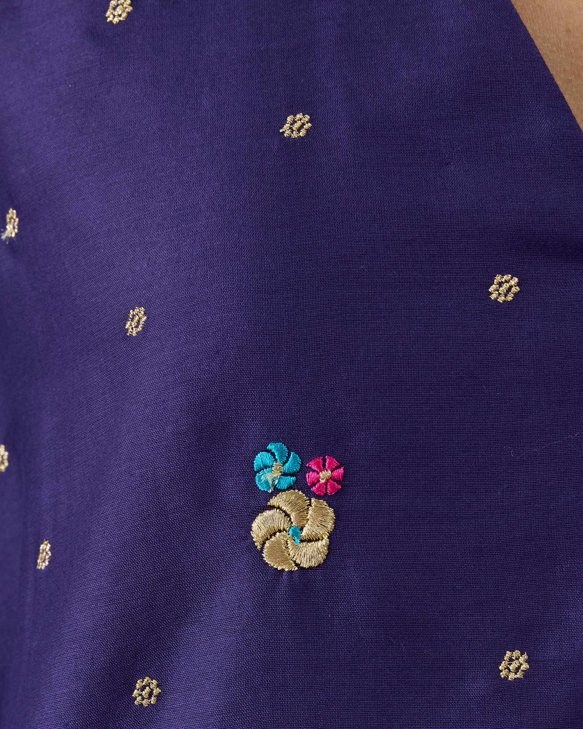 Close-up of floral embroidery on a purple Nebula kurta.