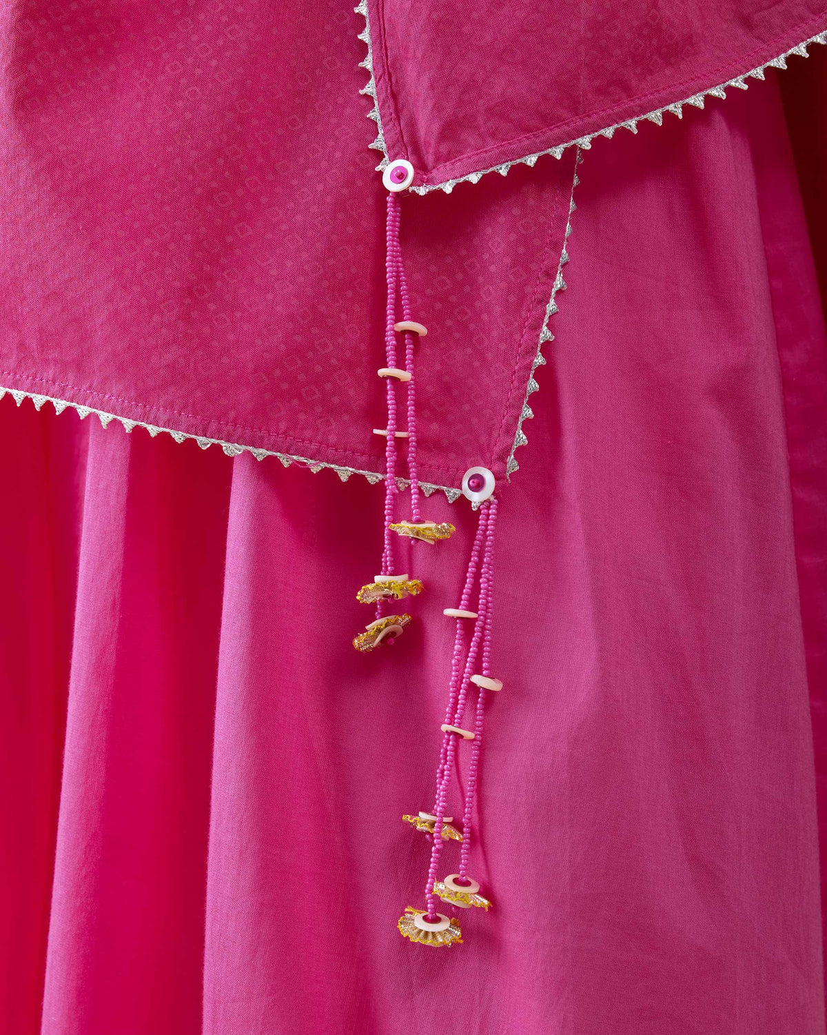 Close-up of a pink Riverdance dupatta showing beaded tassels.