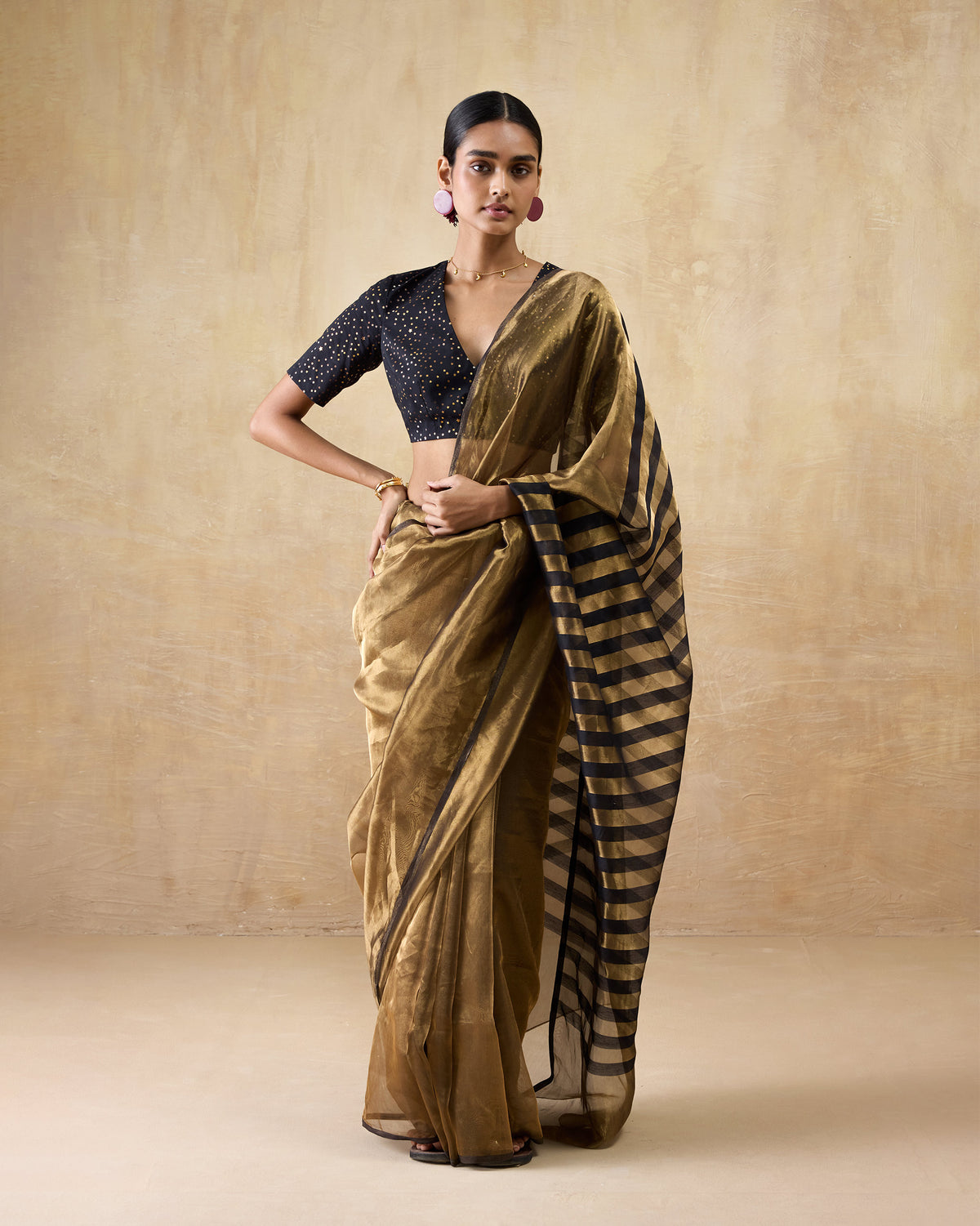 Gold metallic Dancefloor Sari with a sheer body and striped pallu.