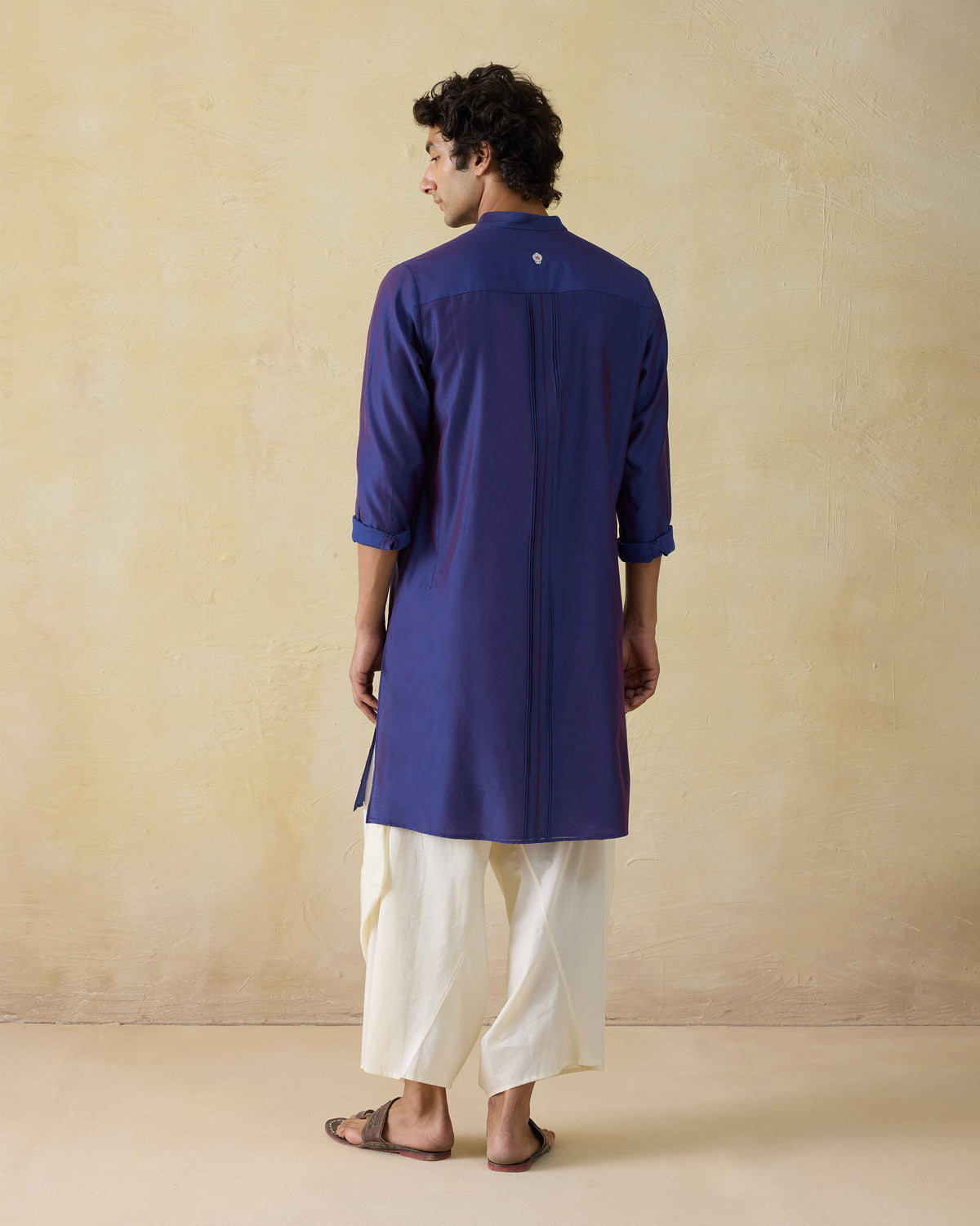 Back of a dual-tone purple Naaz kurta with a white yoke motif.