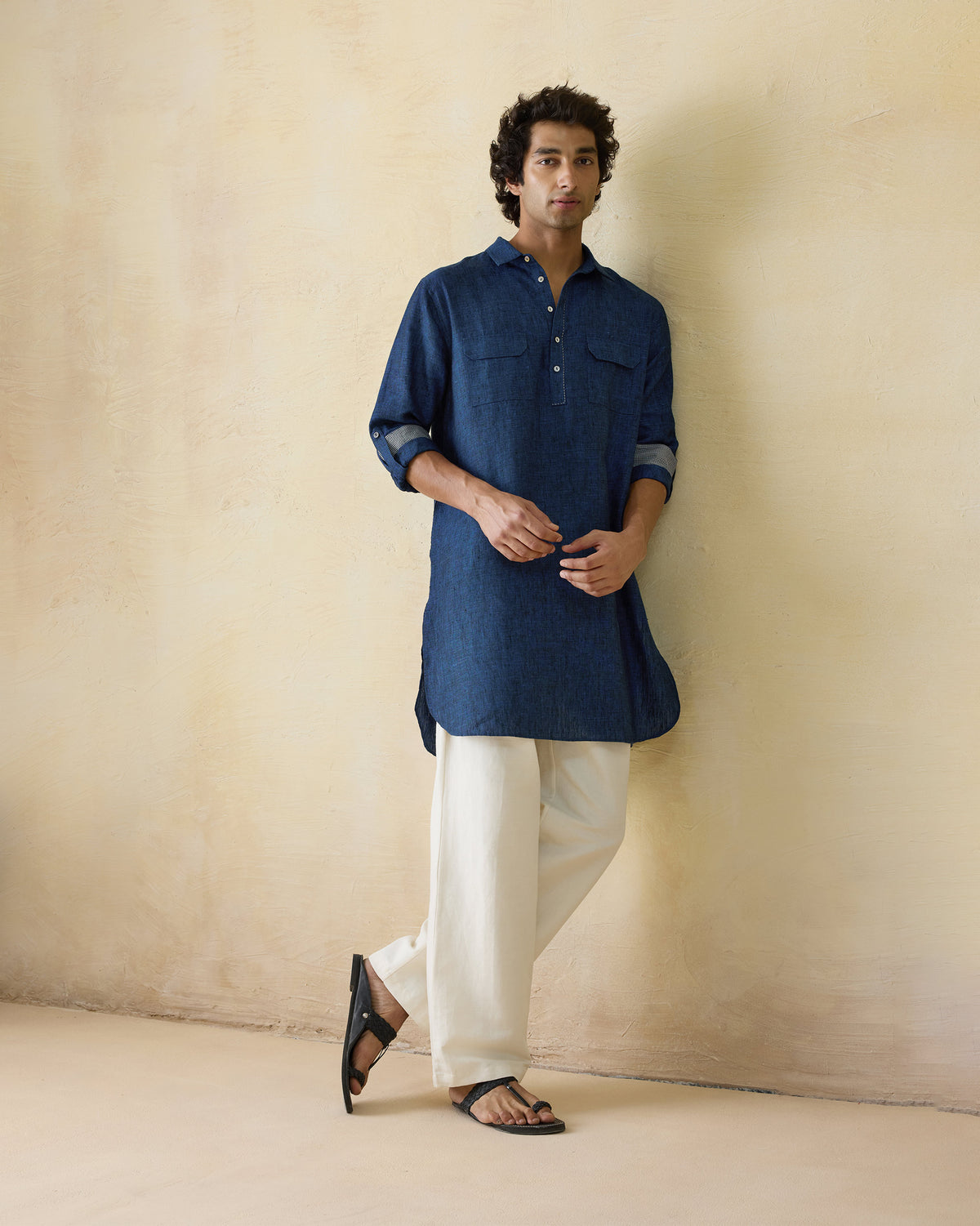 Person wearing a dual shaded blue Amaan linen kurta with chest flap pockets.
