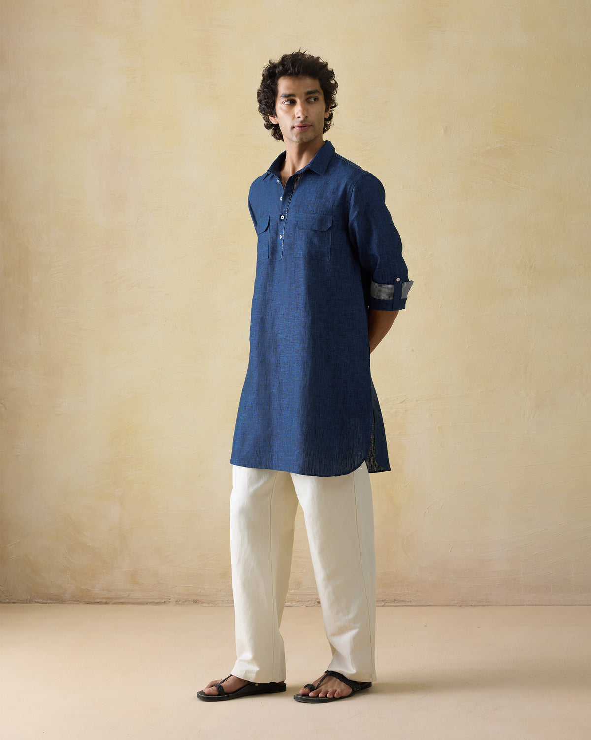 Side view of a dual shaded blue Amaan linen kurta showing mid-thigh length.