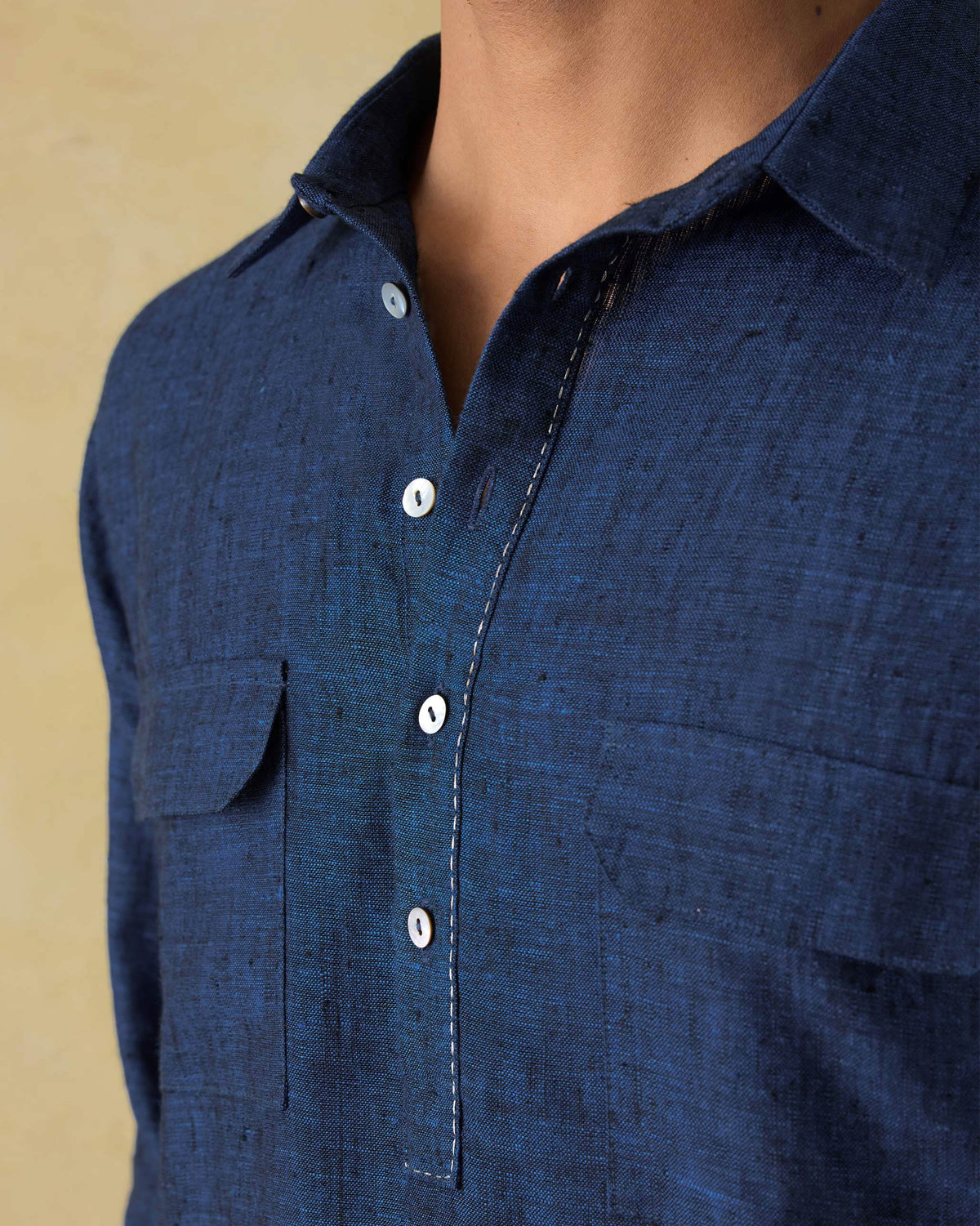 Close-up of a dual shaded blue Amaan kurta showing the placket and chest pocket.