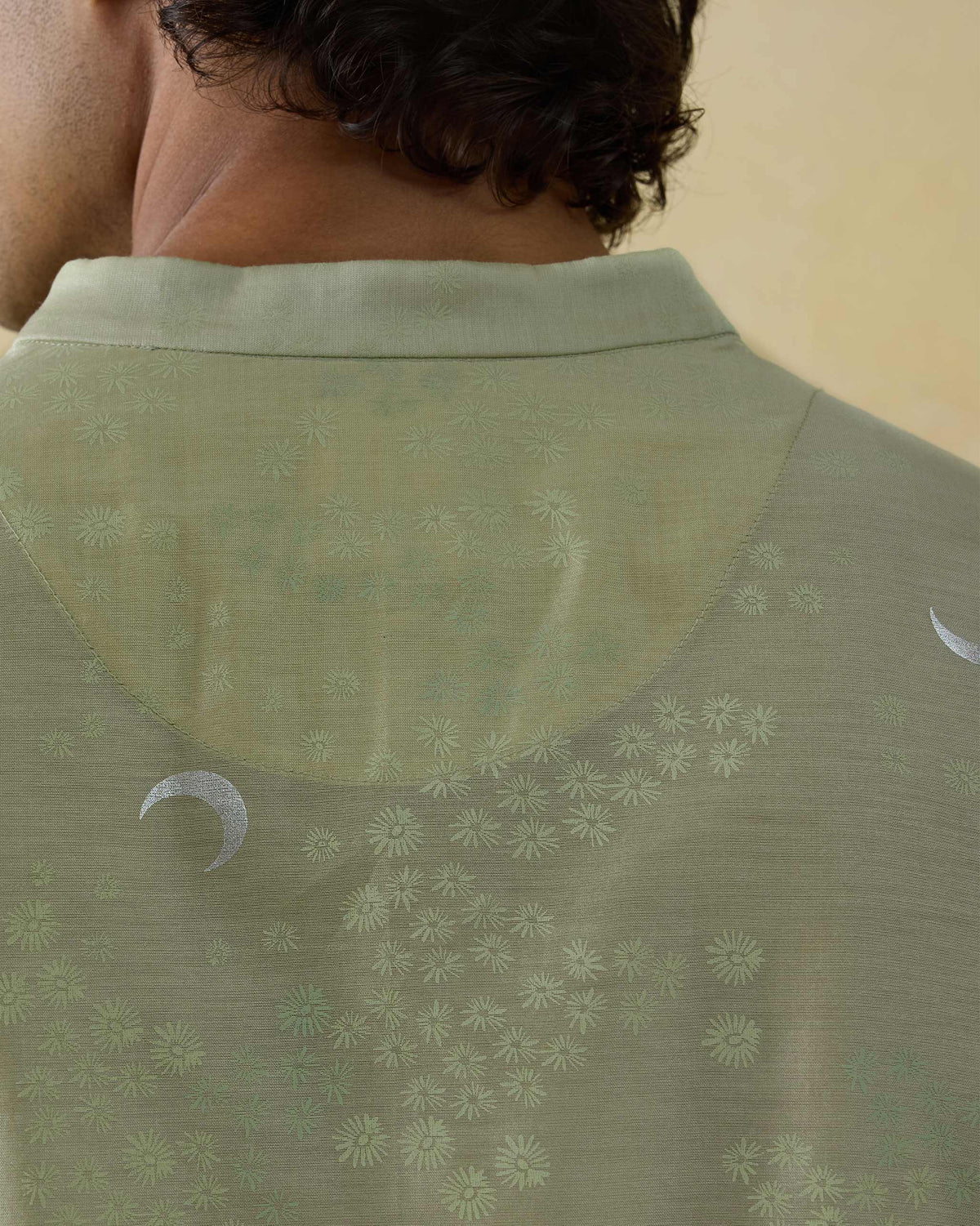 Close-up of mint Bageecha kurta back showing silver crescent moon print.