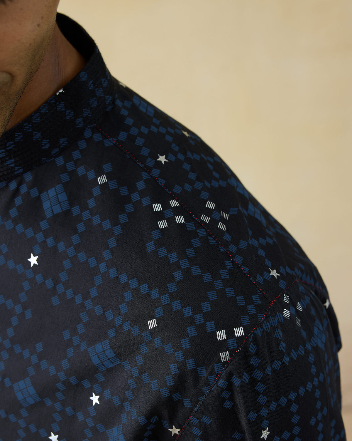 Close-up of a dark navy Neckband Kurta showing a geometric print and band collar.