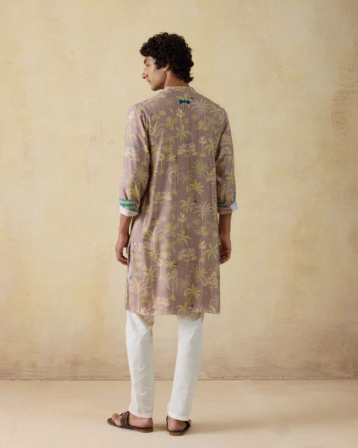 Back of a mauve Chandni Chowk Kurta with a blue embroidered dragonfly below the collar.