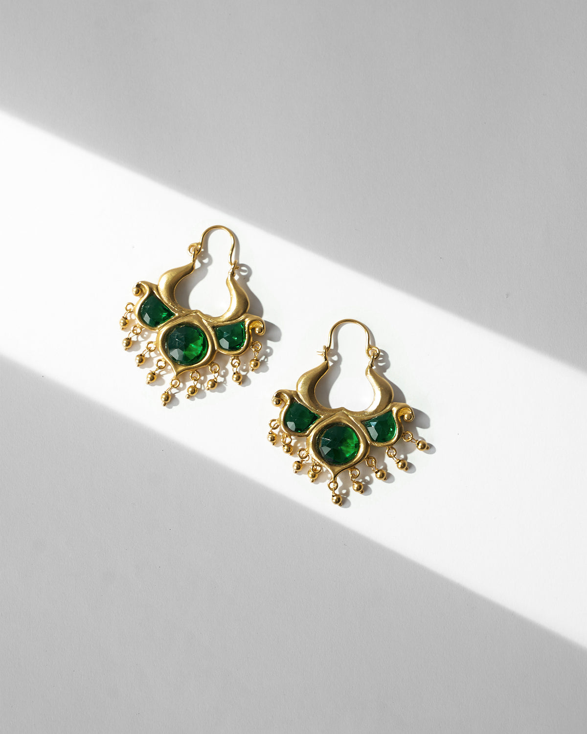Pair of Darbaar Bali earrings laid flat.