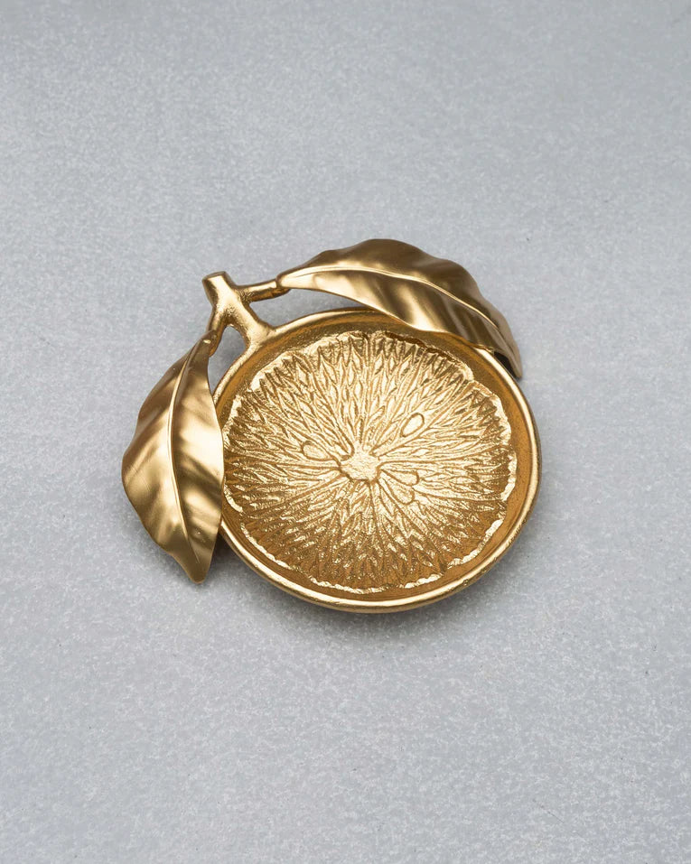Gold Lemon Trinket Tray shaped like a citrus slice with leaf accents.