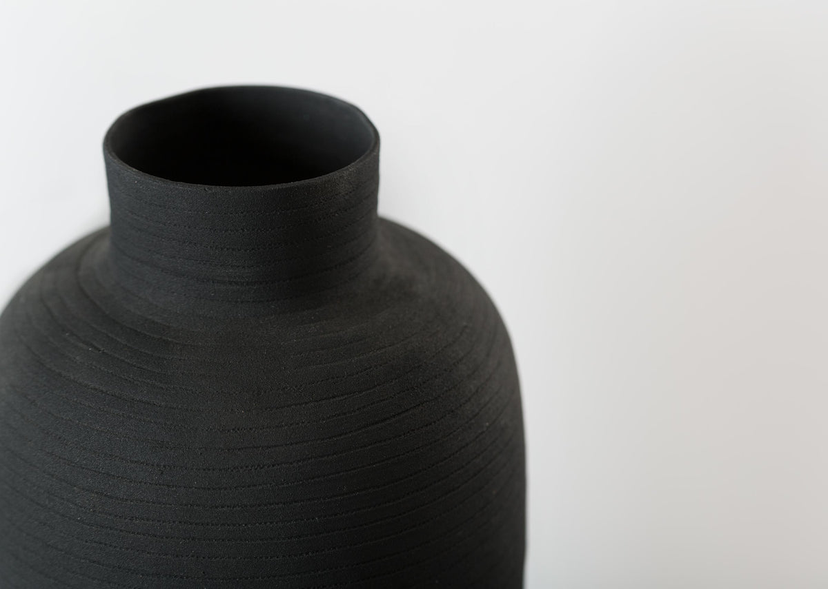 Close-up of the Ceylon Vase's neck, showing its finely grooved matte surface.