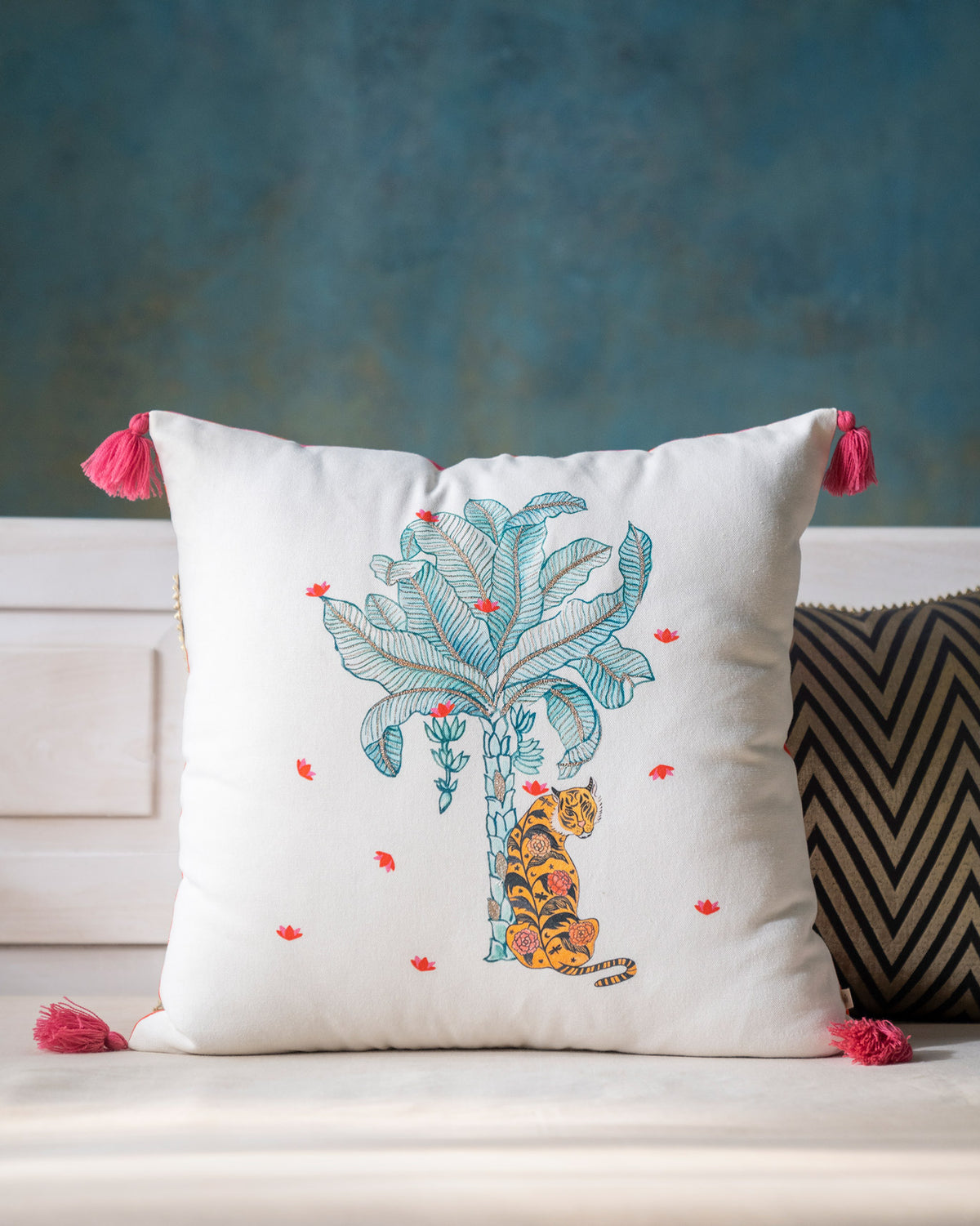 Nirvana cushion cover with a turquoise palm tree and tiger motif.